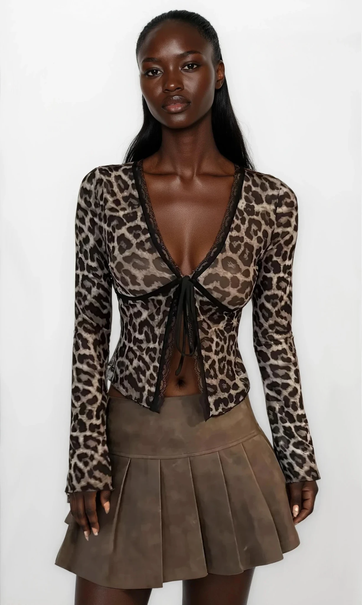 Leopard print V-neck tie-front long sleeve top from Trendsi, stylish casual clothing with a trendy animal print design.
