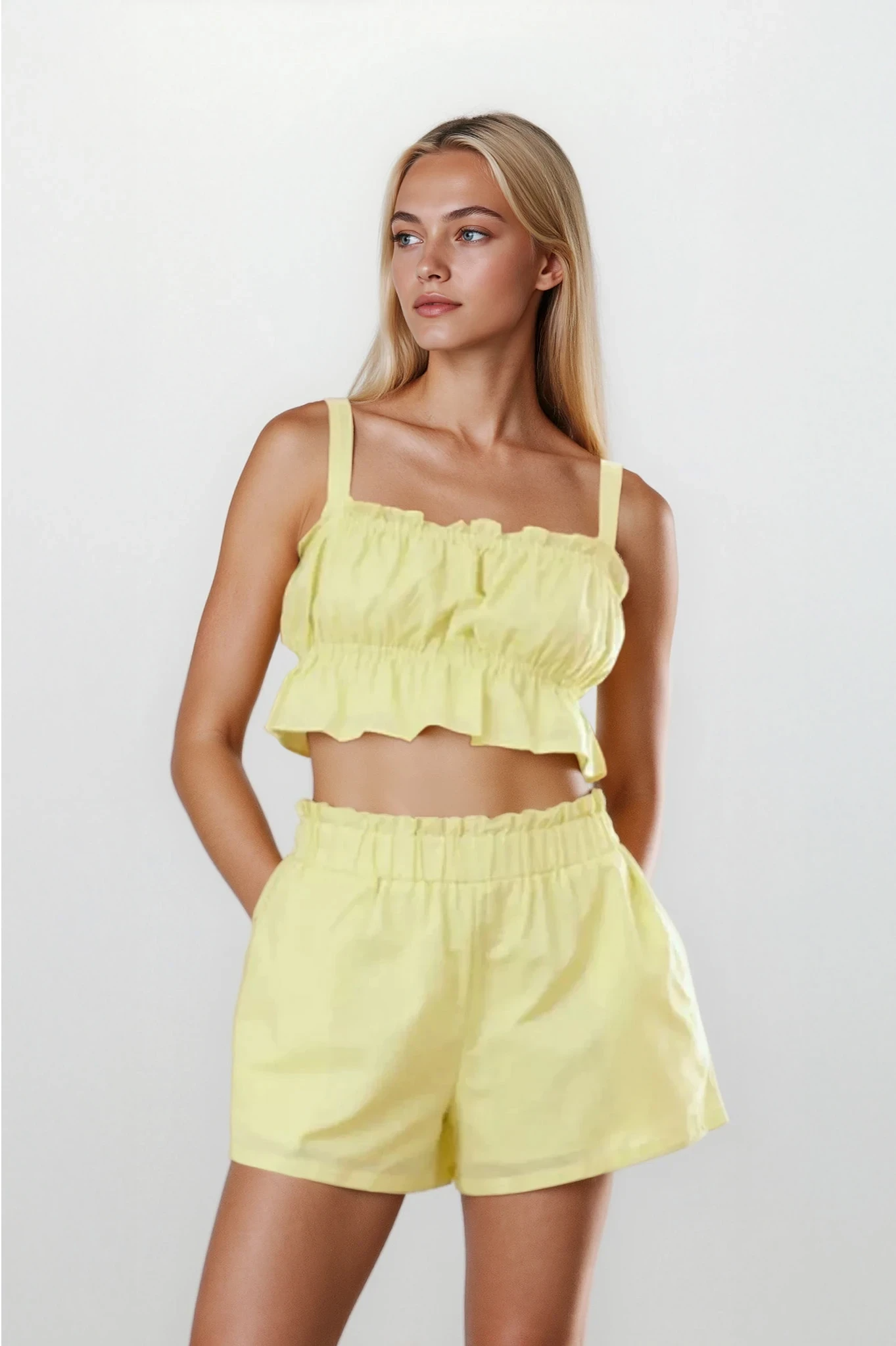 Ines Ruffle Square Neck Cami and Shorts set by Trendsi, featuring a light-colored ruffled cami top and matching shorts.