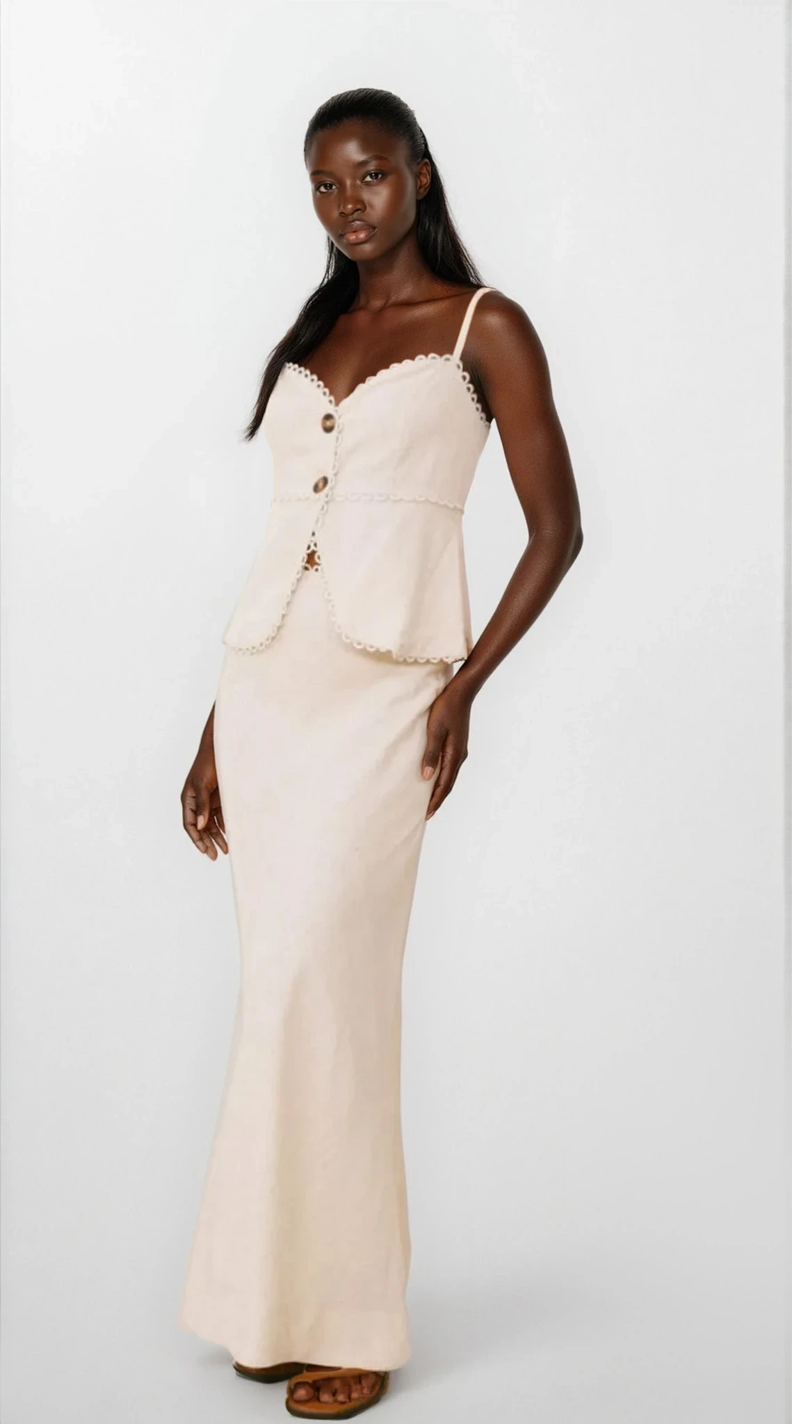 Light-colored Elara Lace Trim Button Front Cami and Skirt Set from Trendsi, featuring delicate lace details and a stylish button-front design.