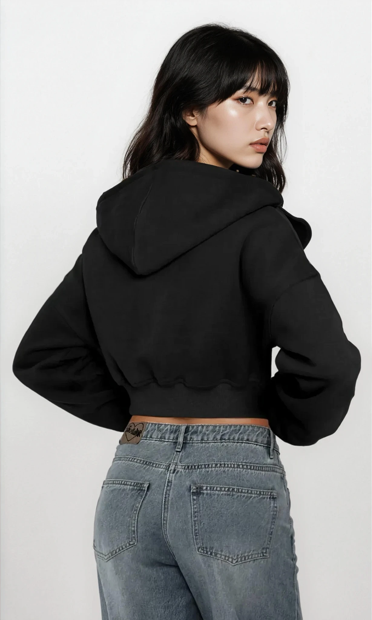 Light gray Downtown Full Zip Cropped Hoodie by Trendsi, featuring a front zipper, hood, and cropped design, worn casually.