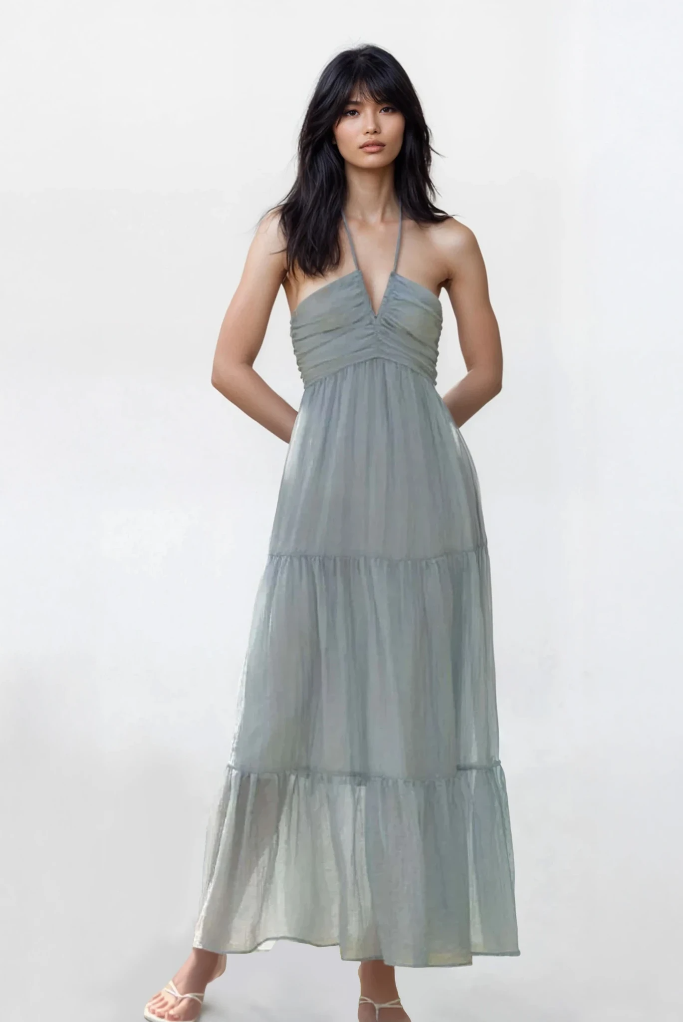 Light blue Solstice halter neck tiered cami dress from Trendsi, featuring a flowing tiered design and lightweight fabric.