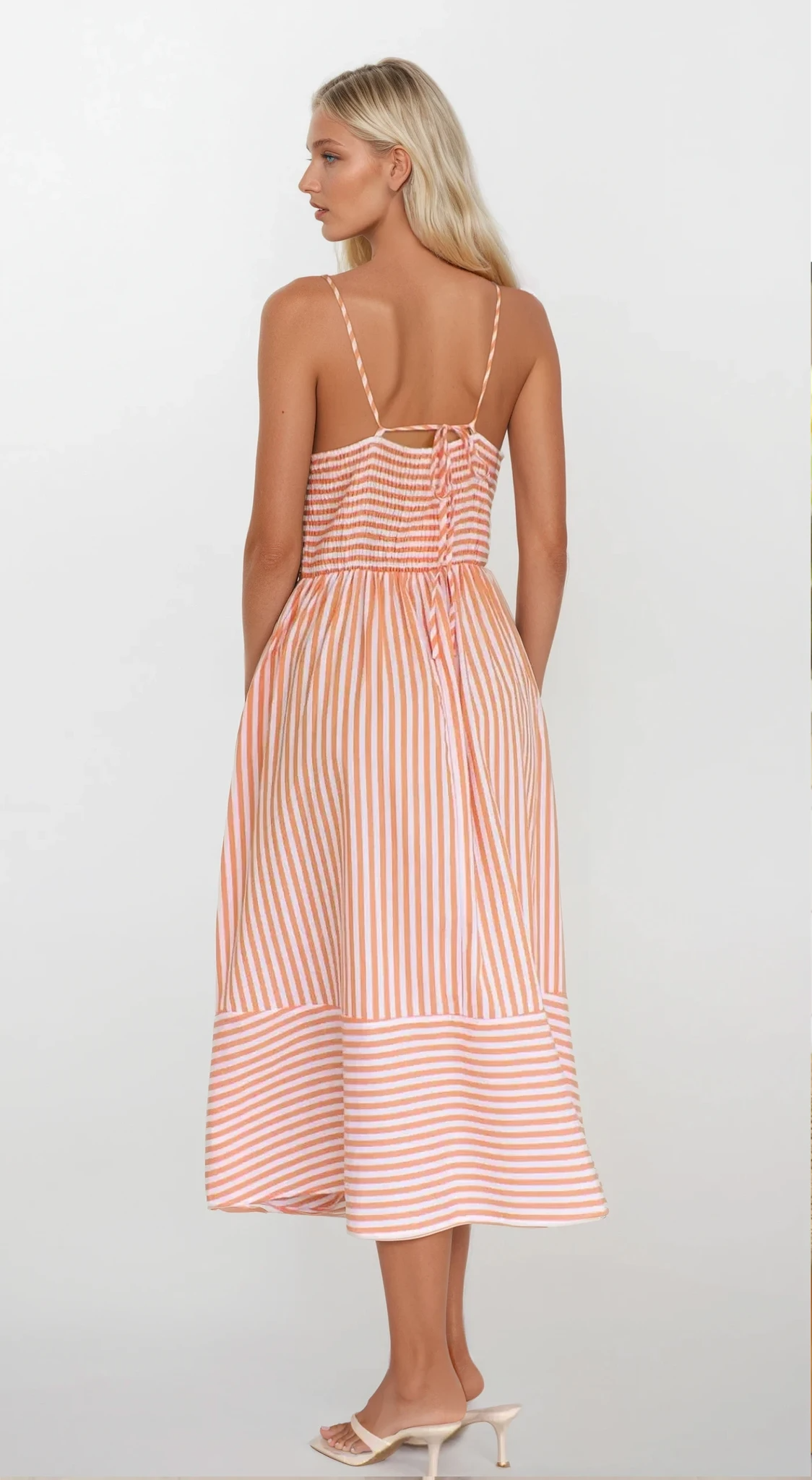 Sunset Stripe Cami Midi Dress by Trendsi featuring a lightweight fabric with a sunset stripe pattern and adjustable spaghetti straps.