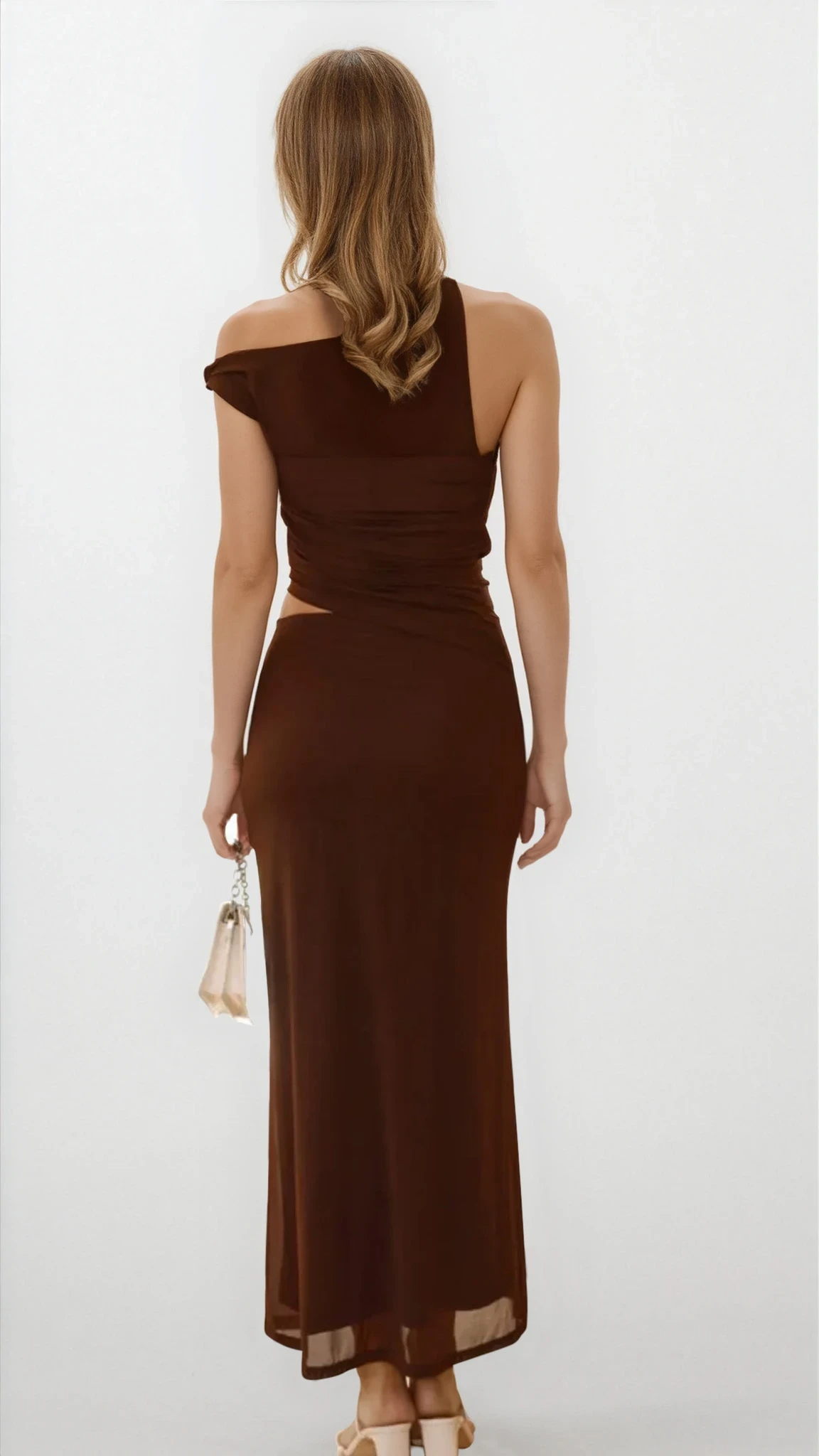 Light-colored Echelon asymmetrical cutout sleeveless dress from Trendsi, showcasing its unique design and stylish fit.