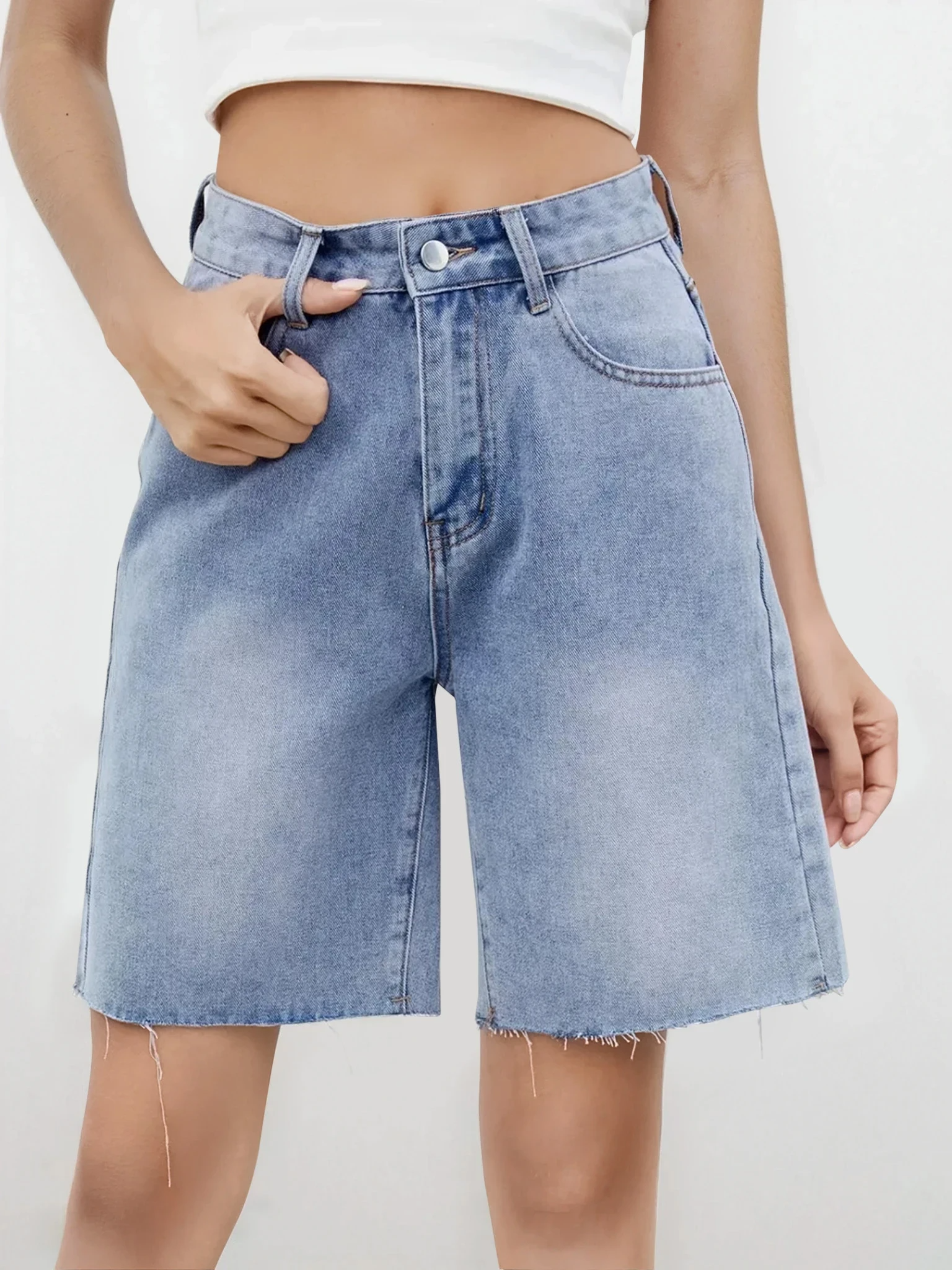 Light wash Rogue Raw Hem Denim Shorts by Trendsi, showing distressed edges and casual fit on a model.