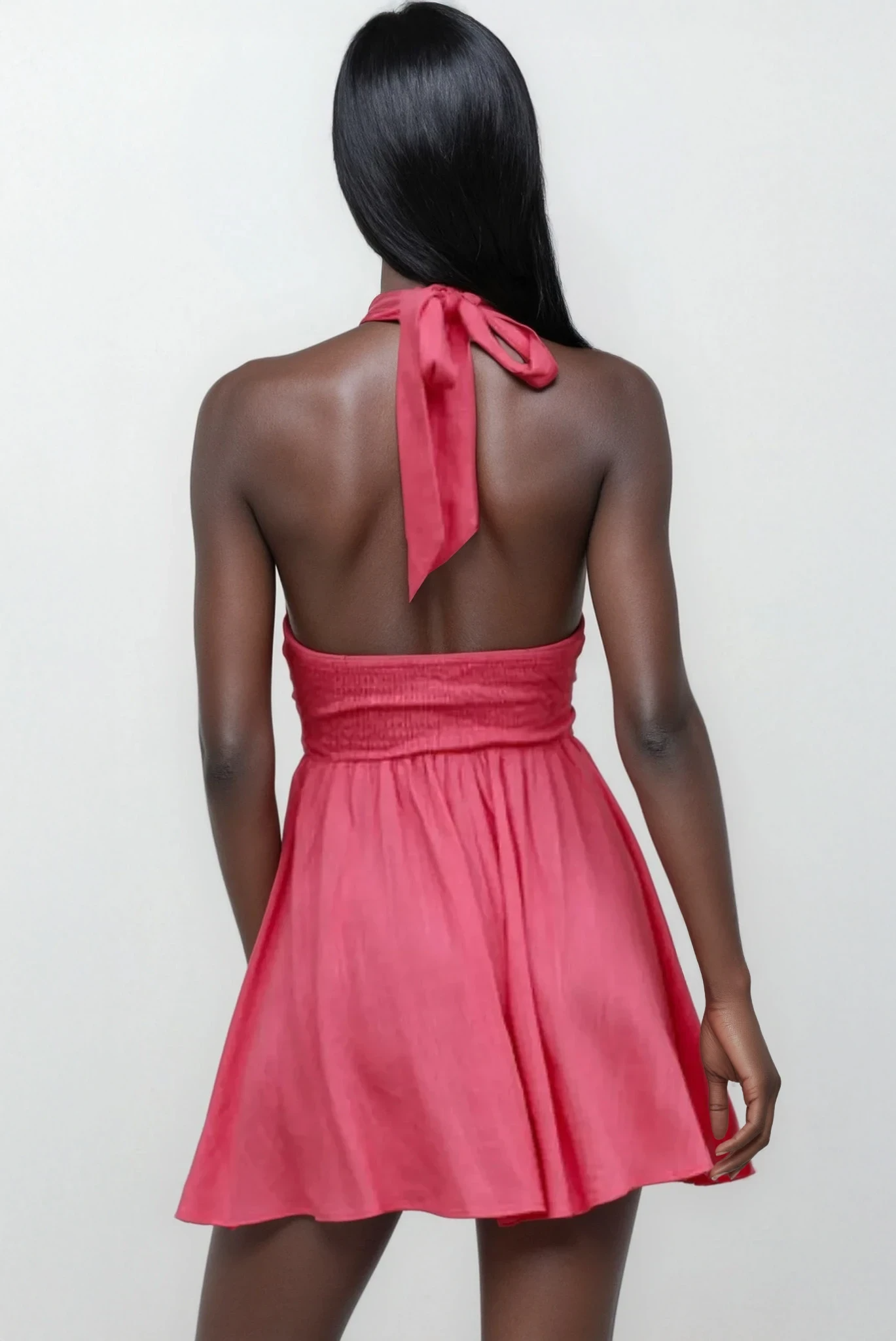 Light blue Lumina Cutout Halter Neck Mini Dress by Trendsi featuring a stylish cutout design and halter neckline.