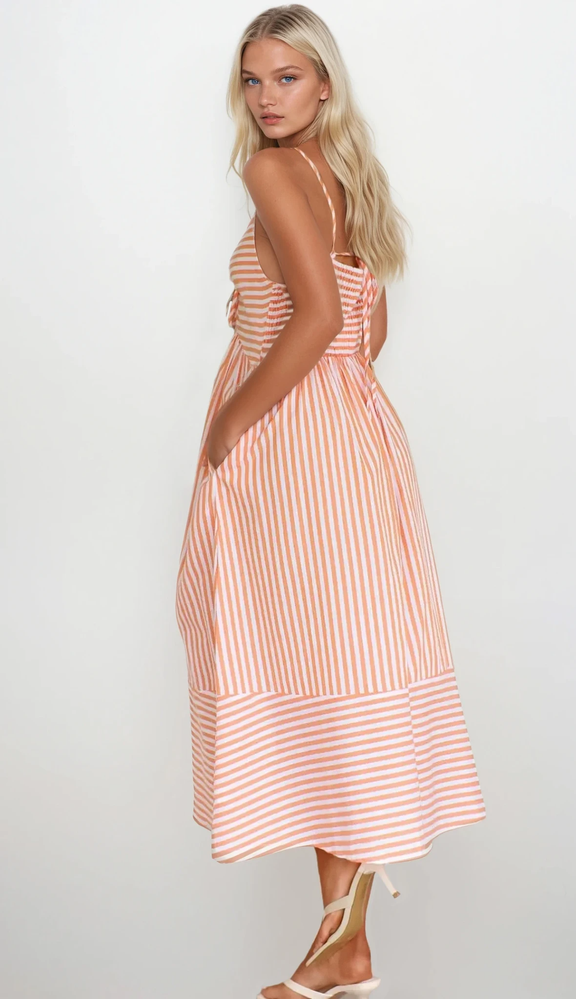 Sunset Stripe Cami Midi Dress by Trendsi, featuring a sleeveless design with colorful sunset stripe pattern on lightweight fabric.