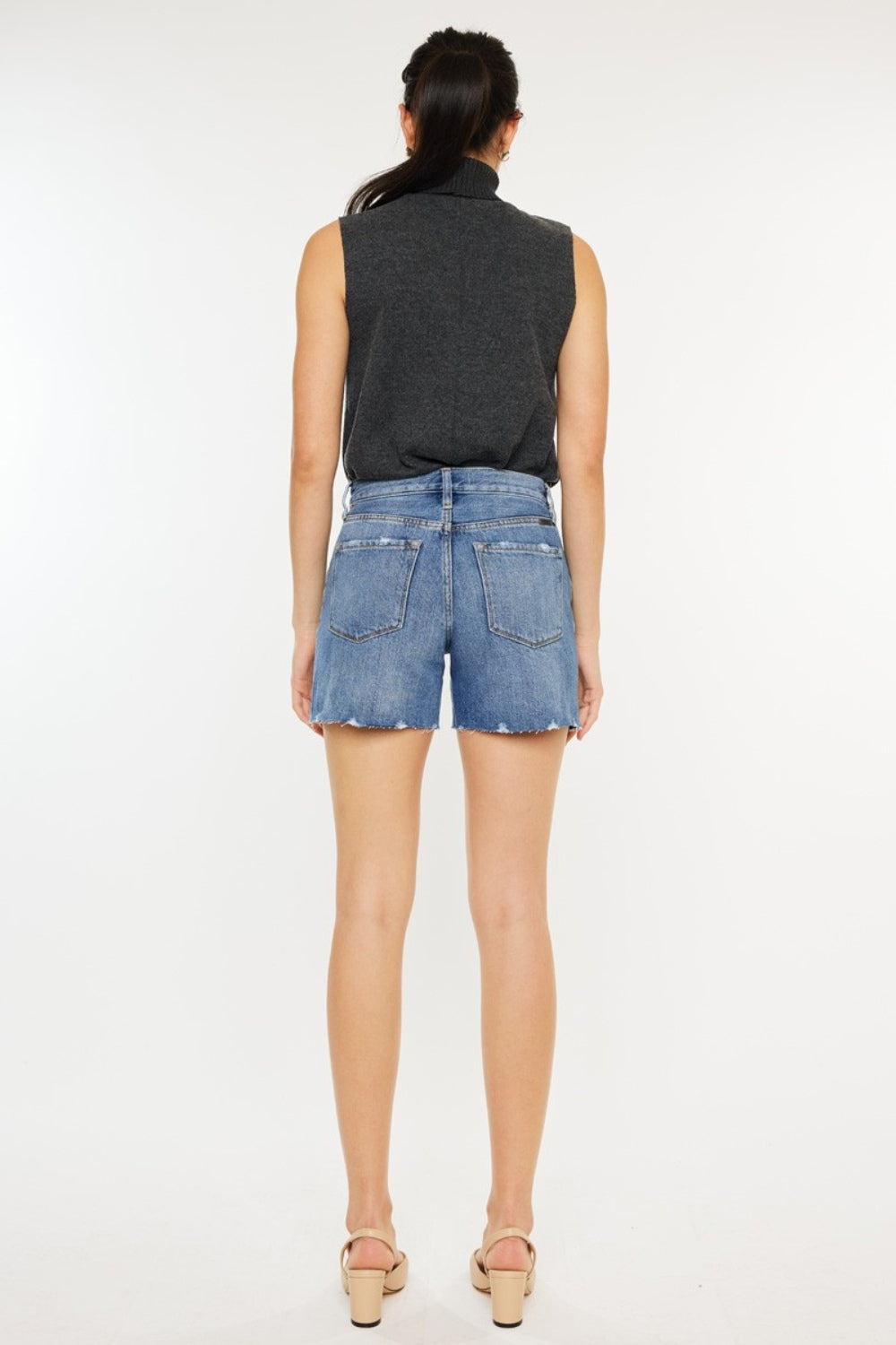 Signature high-waist raw hem distressed denim shorts by Trendsi, with frayed edges and worn-in distressed details.