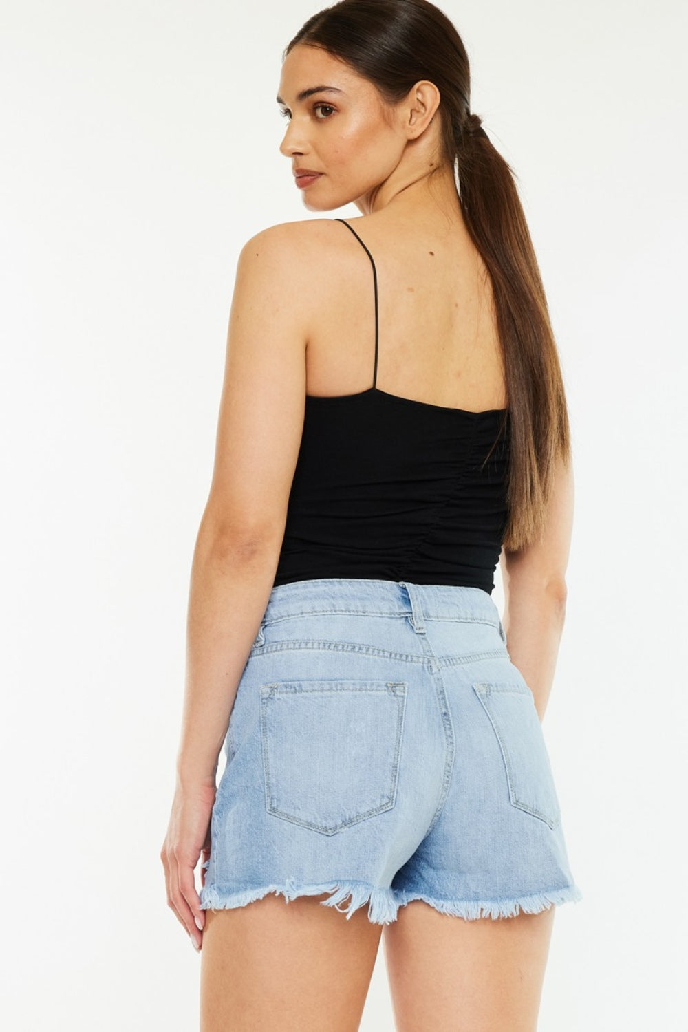 Signature high-waist raw hem vintage denim shorts by Trendsi, featuring distressed raw edge details and classic blue denim fabric.