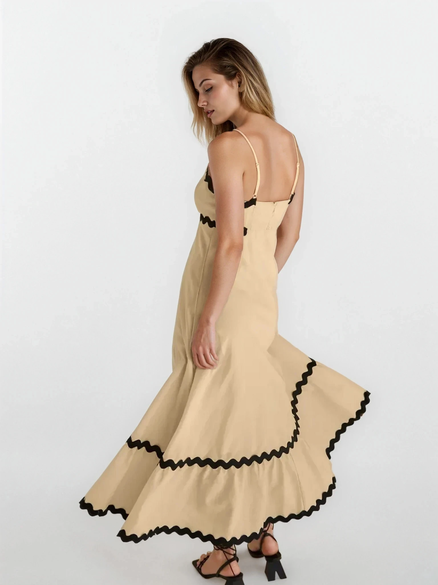 Light blue Tidal spaghetti strap maxi dress from Trendsi, featuring a flowy silhouette and adjustable straps.