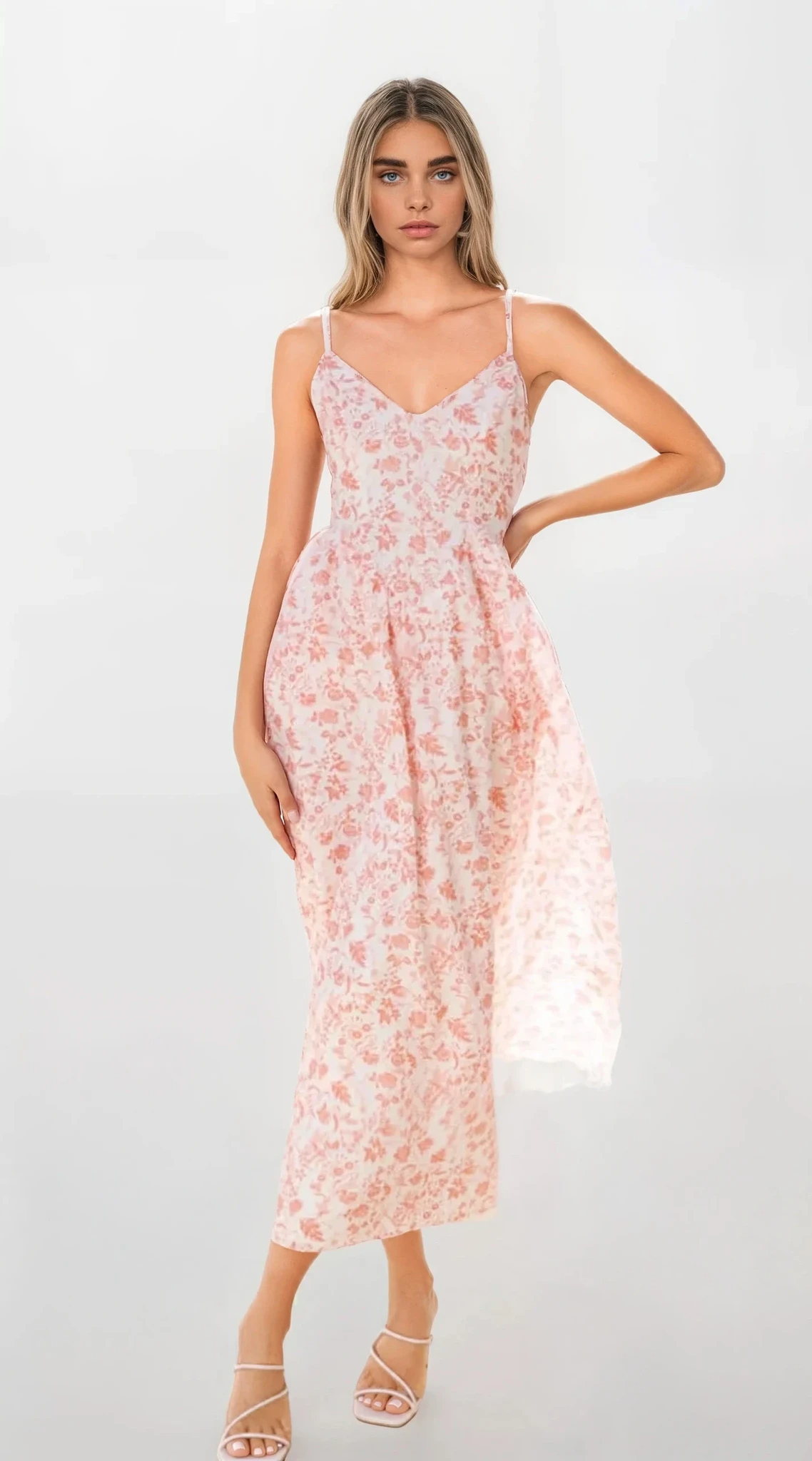 Fleuron Bow Back V-Neck Cami Dress by Trendsi featuring a light-colored fabric, bow detail at the back, and a V-neck design.