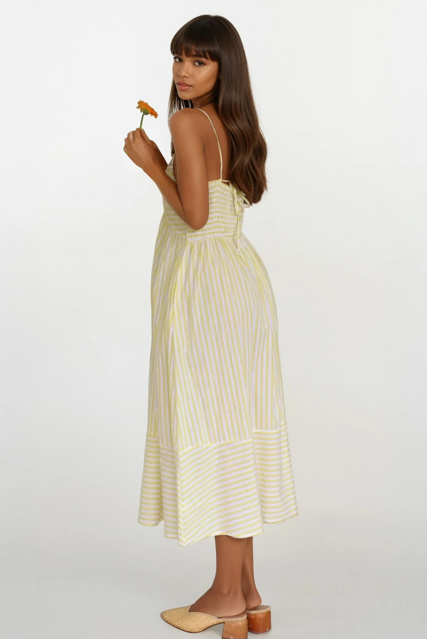 Sunset Stripe Cami Midi Dress from Trendsi featuring a sleeveless design, midi length, and vibrant sunset-inspired stripe pattern.