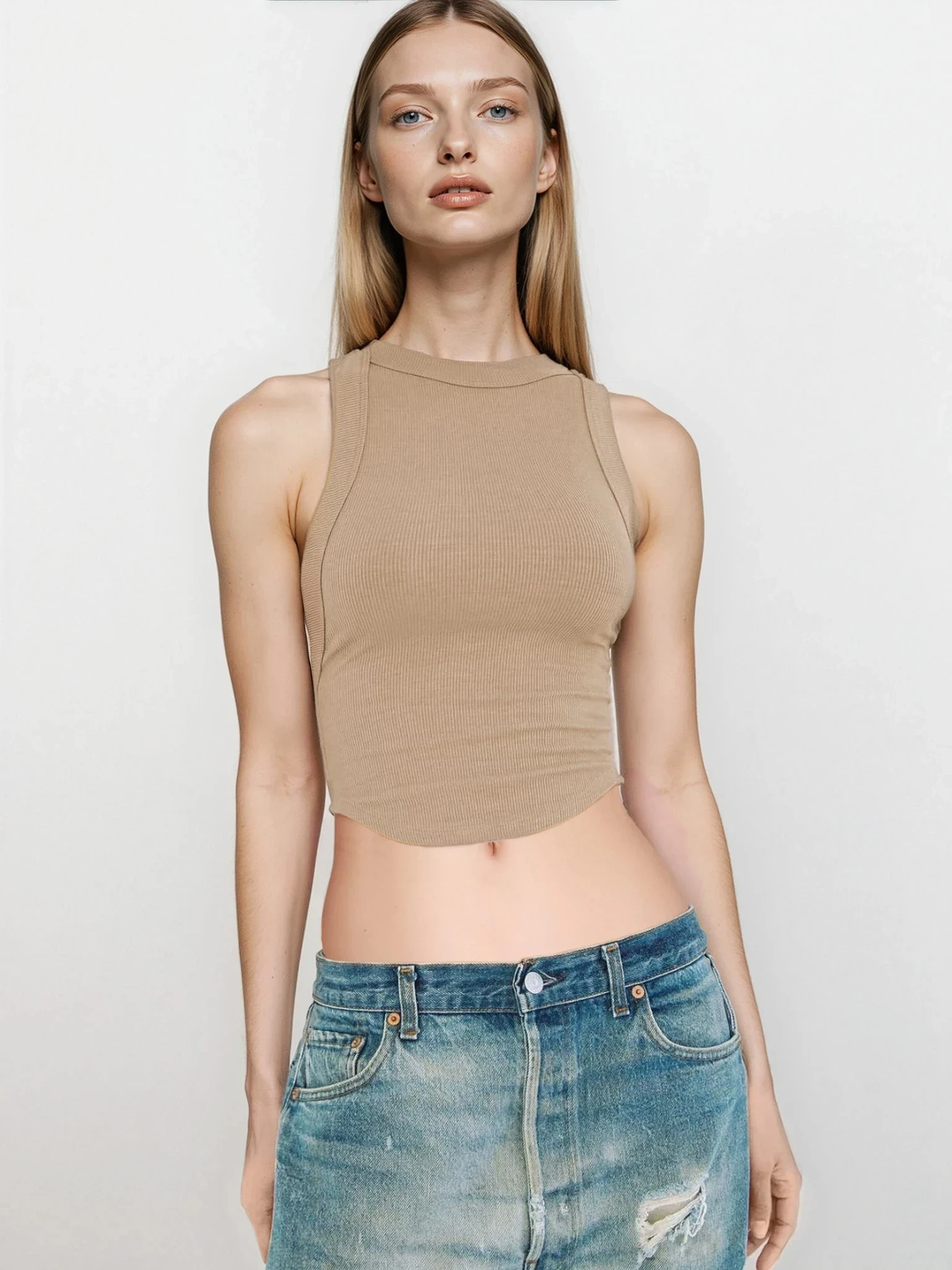 Light blue rib-knit halter neck sleeveless cropped tank top by Trendsi, showcasing the fitted halter design and sleeveless style.