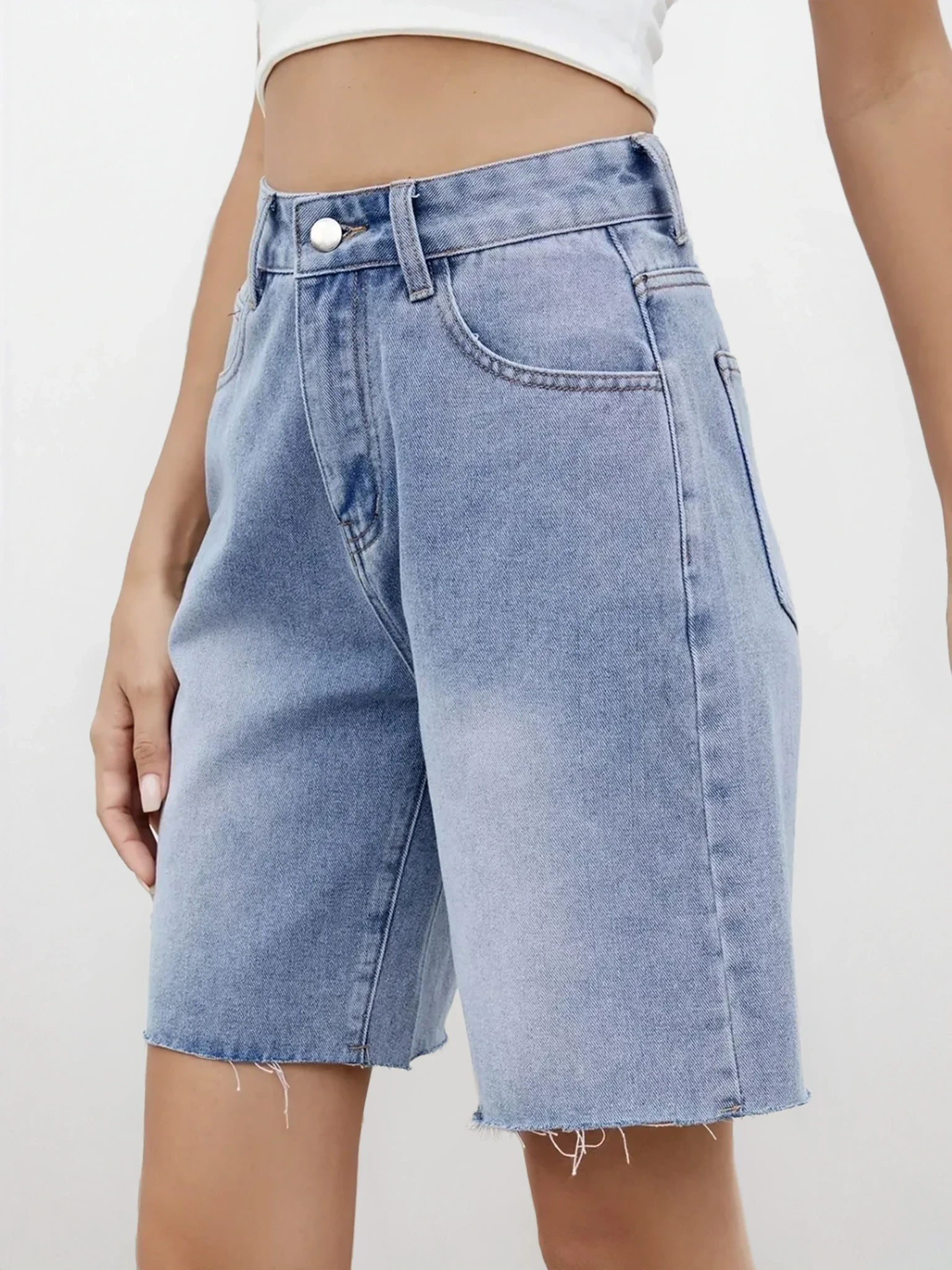 Light wash Rogue Raw Hem Denim Shorts by Trendsi, showing distressed denim with frayed raw hems and relaxed fit.