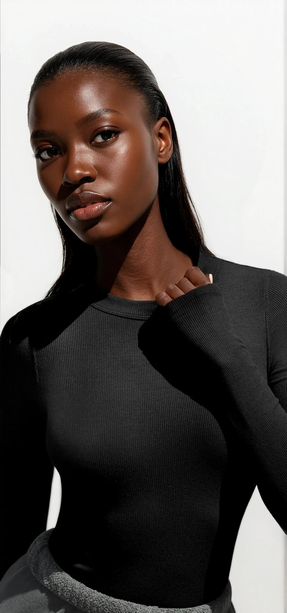 Light-colored Trendsi round neck long sleeve T-shirt with a simple, fitted design displayed on a mannequin.