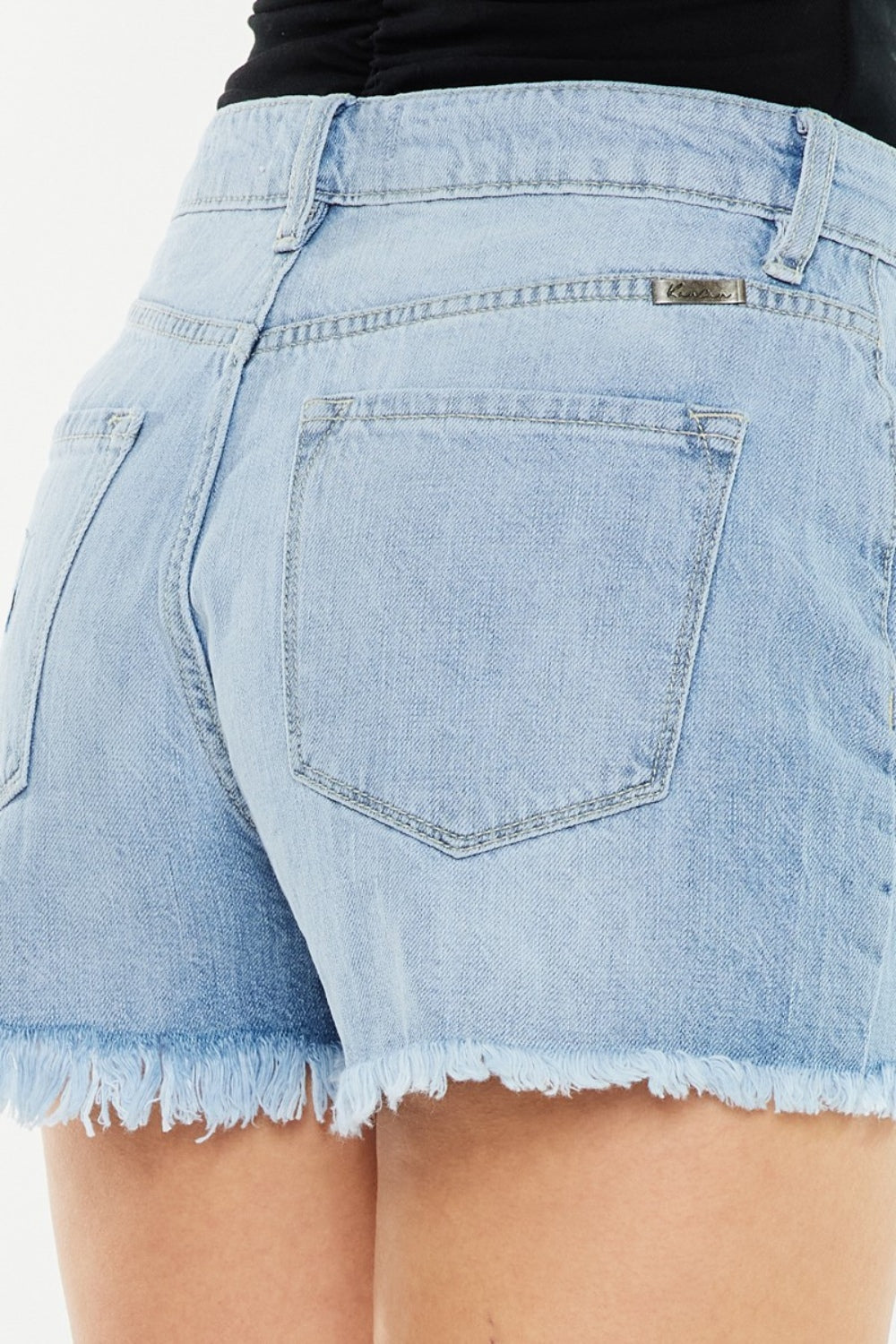 Trendsi Signature high-waist raw hem vintage denim shorts styled with casual top and accessories, showcasing a trendy summer look.