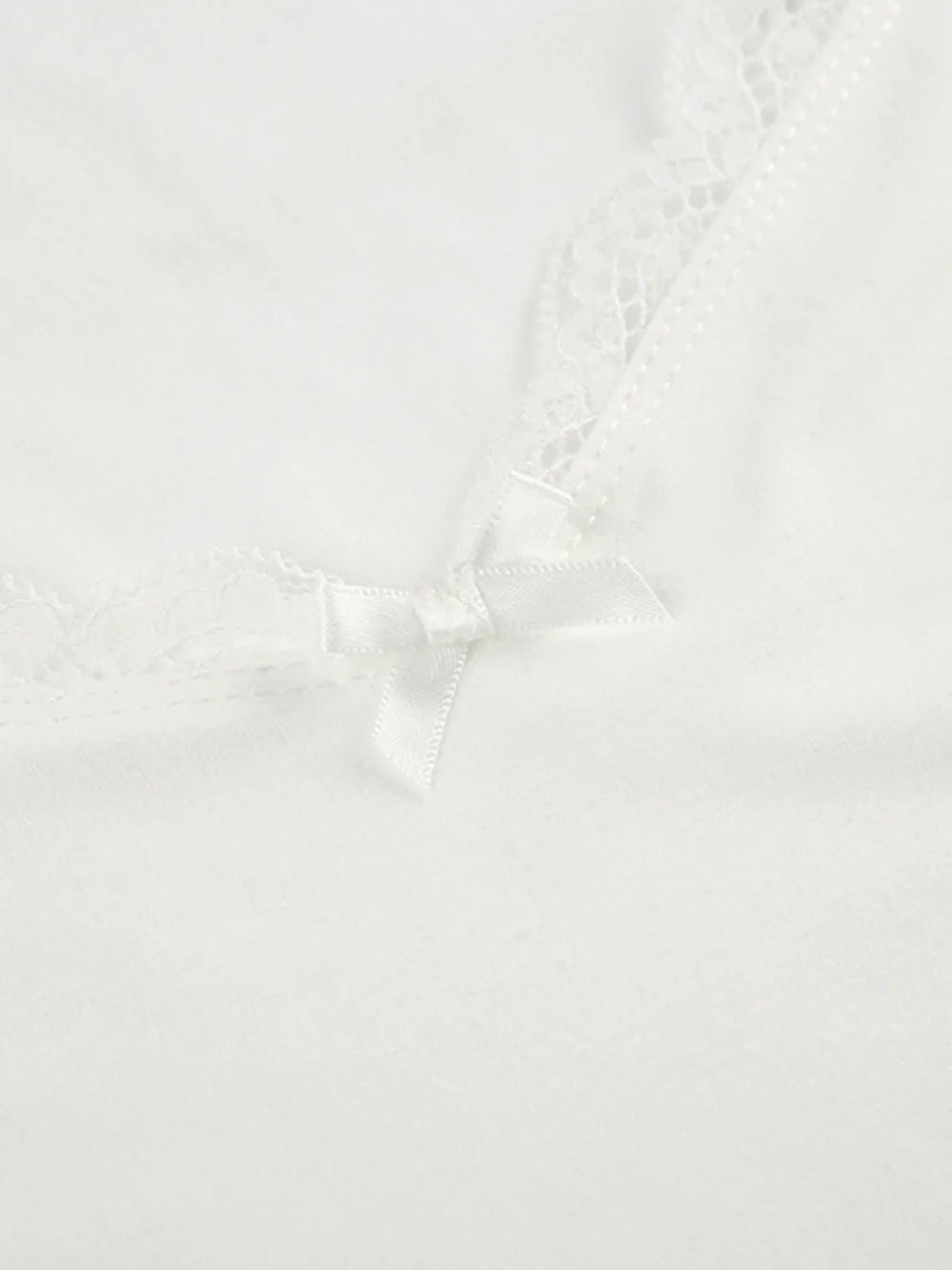 Lace sweetheart neck short sleeve blouse from Trendsi, featuring delicate lace fabric and a feminine, fitted design.