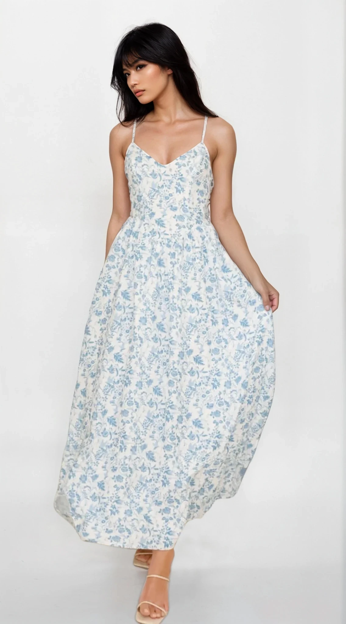 Light blue Fleuron Bow Back V-Neck Cami Dress by Trendsi with delicate floral details and bow-back design, styled for casual elegance.