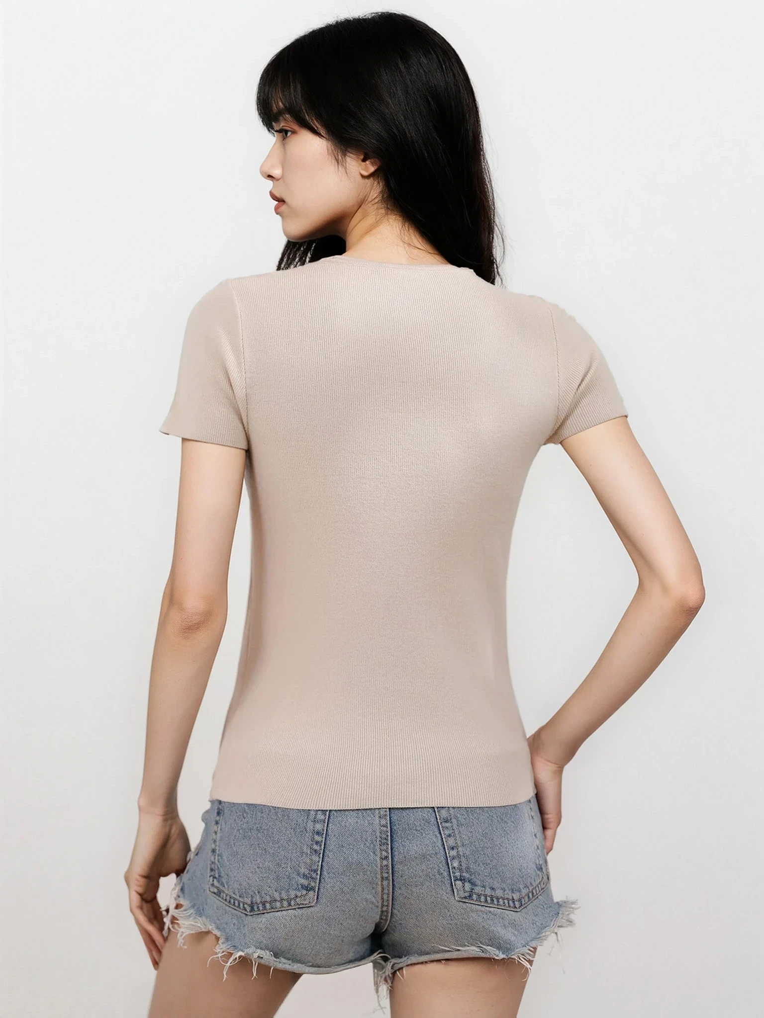 Light gray Luxe Cutout Round Neck Short Sleeve Knit Top from Trendsi, featuring stylish cutouts and a comfortable fit.