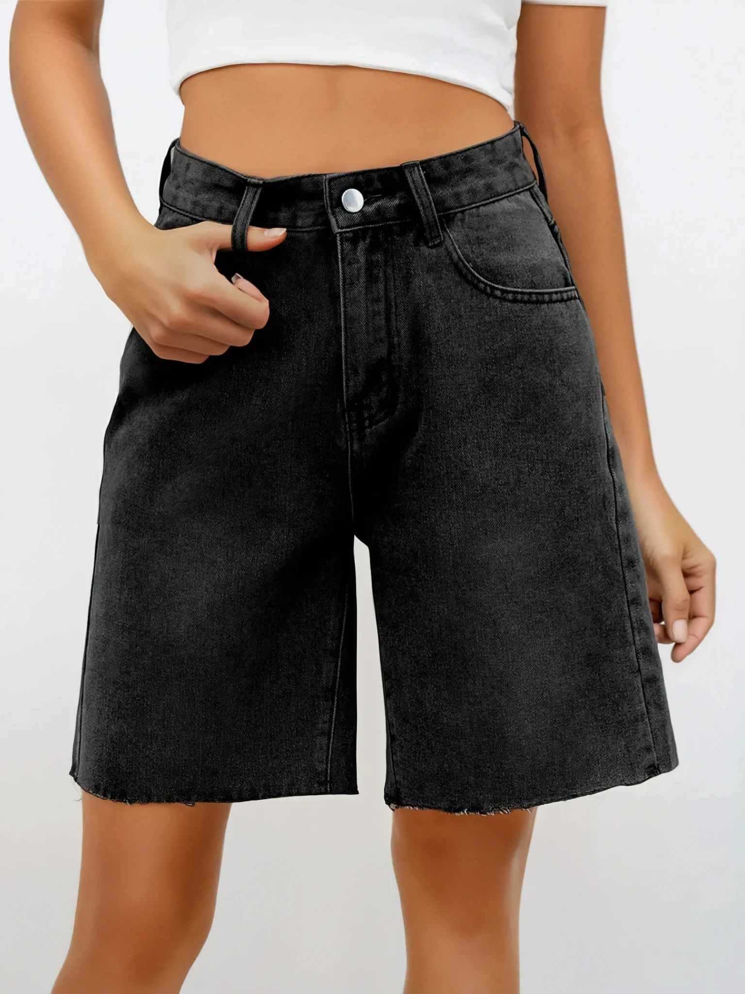 Light wash Rogue Raw Hem Denim Shorts by Trendsi, featuring distressed details and a casual fit, shown on a model.