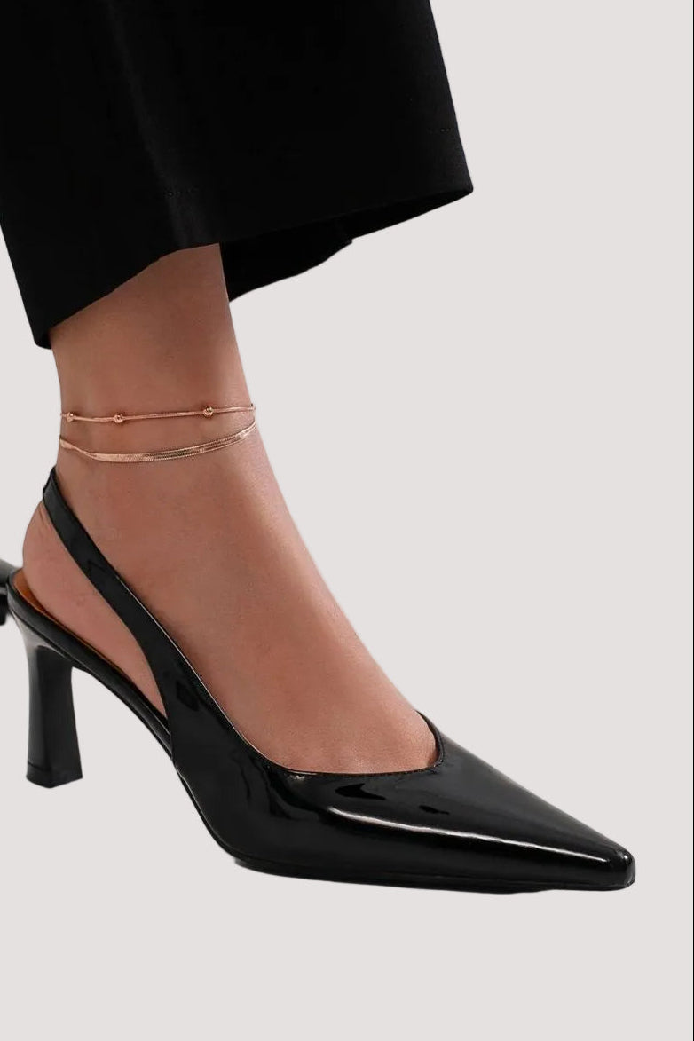 Faux leather pointed toe slingback pumps from Trendsi, stylish women's shoes with sleek design and open back.