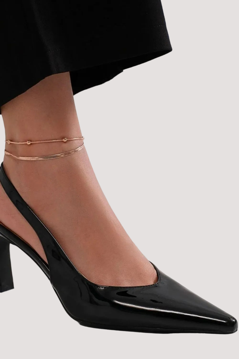 Faux leather pointed toe slingback pumps with a stylish design, perfect for chic footwear by Trendsi.