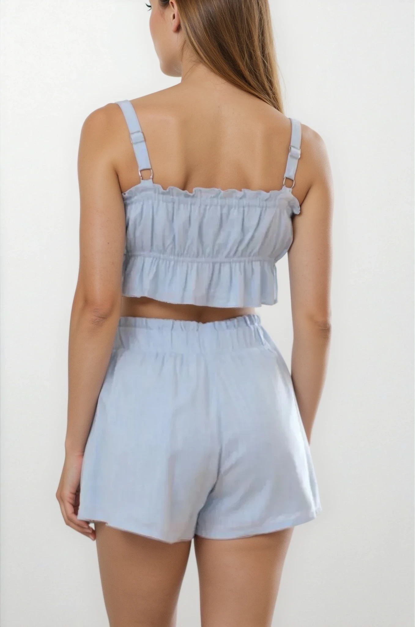 Ines Ruffle Square Neck Cami and Short Set by Trendsi, featuring a light-colored ruffle-cami top and matching shorts.
