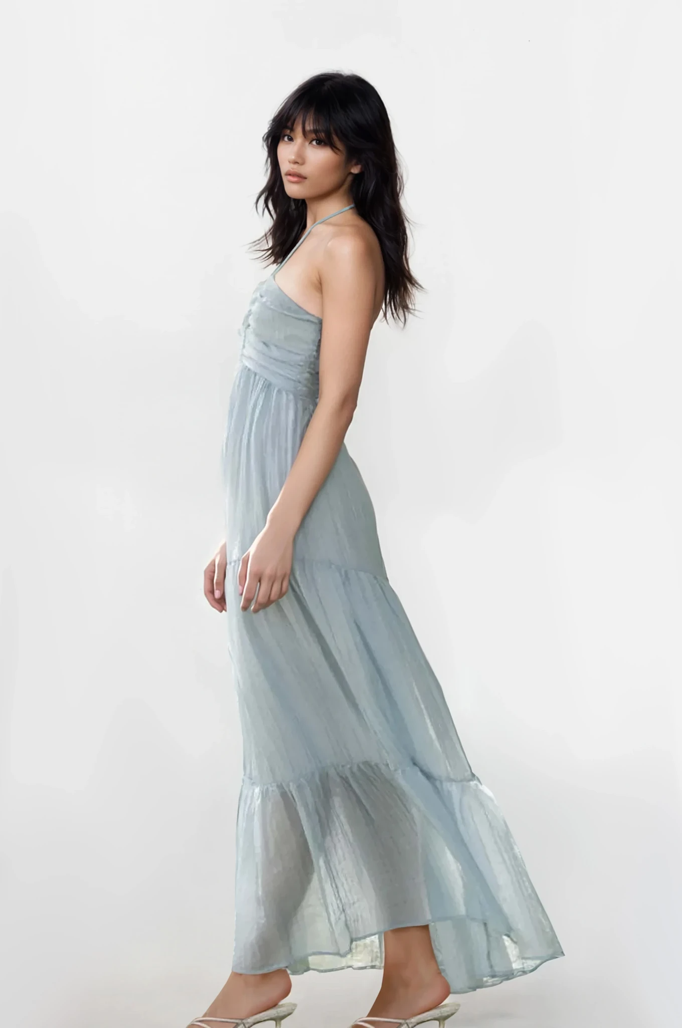Light blue Solstice halter neck tiered cami dress from Trendsi, featuring a flowy tiered design and halter strap detail.