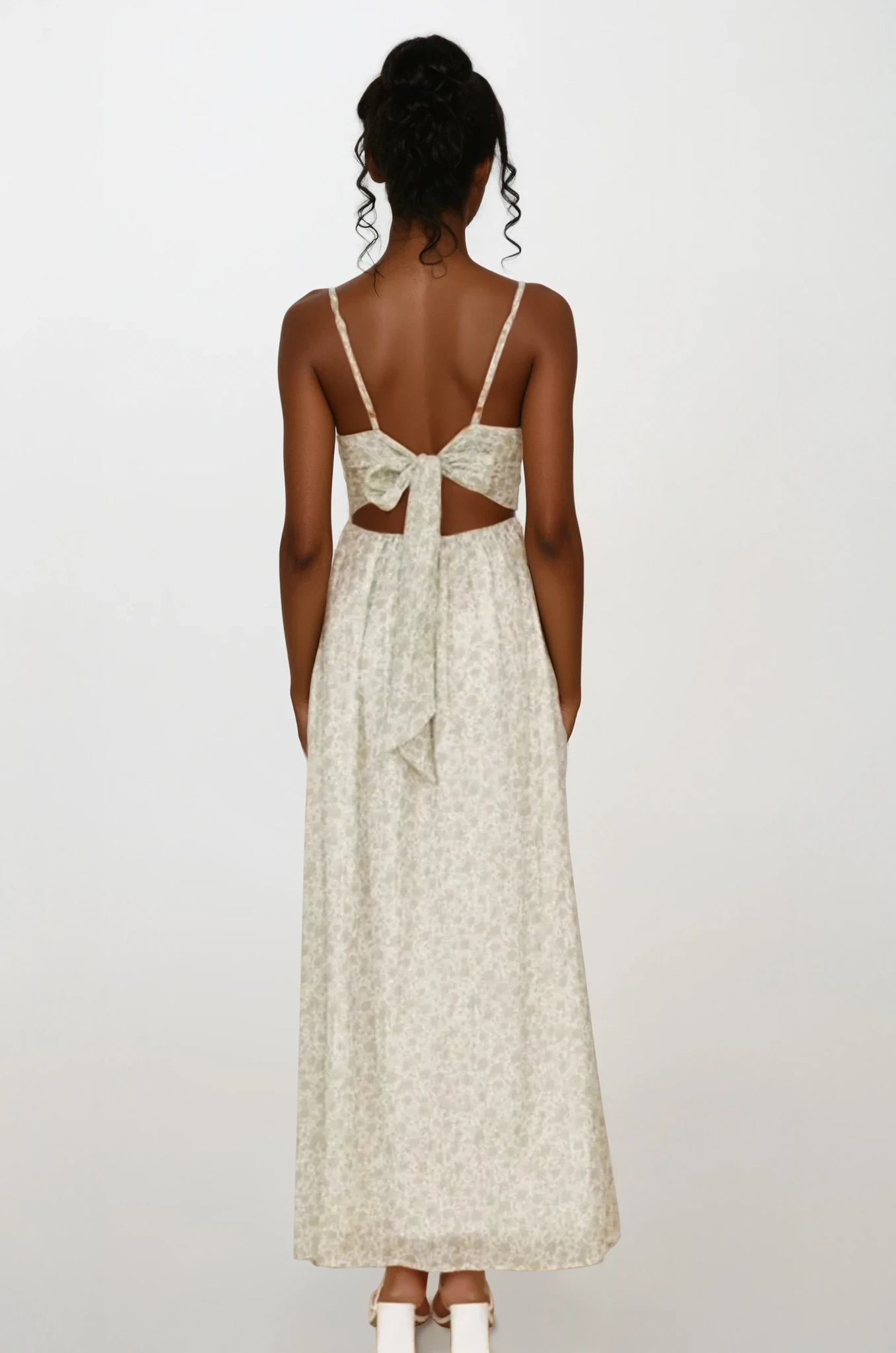 Fleuron Bow Back V-Neck Cami Dress by Trendsi, featuring a stylish V-neck, bow back detail, and lightweight fabric.