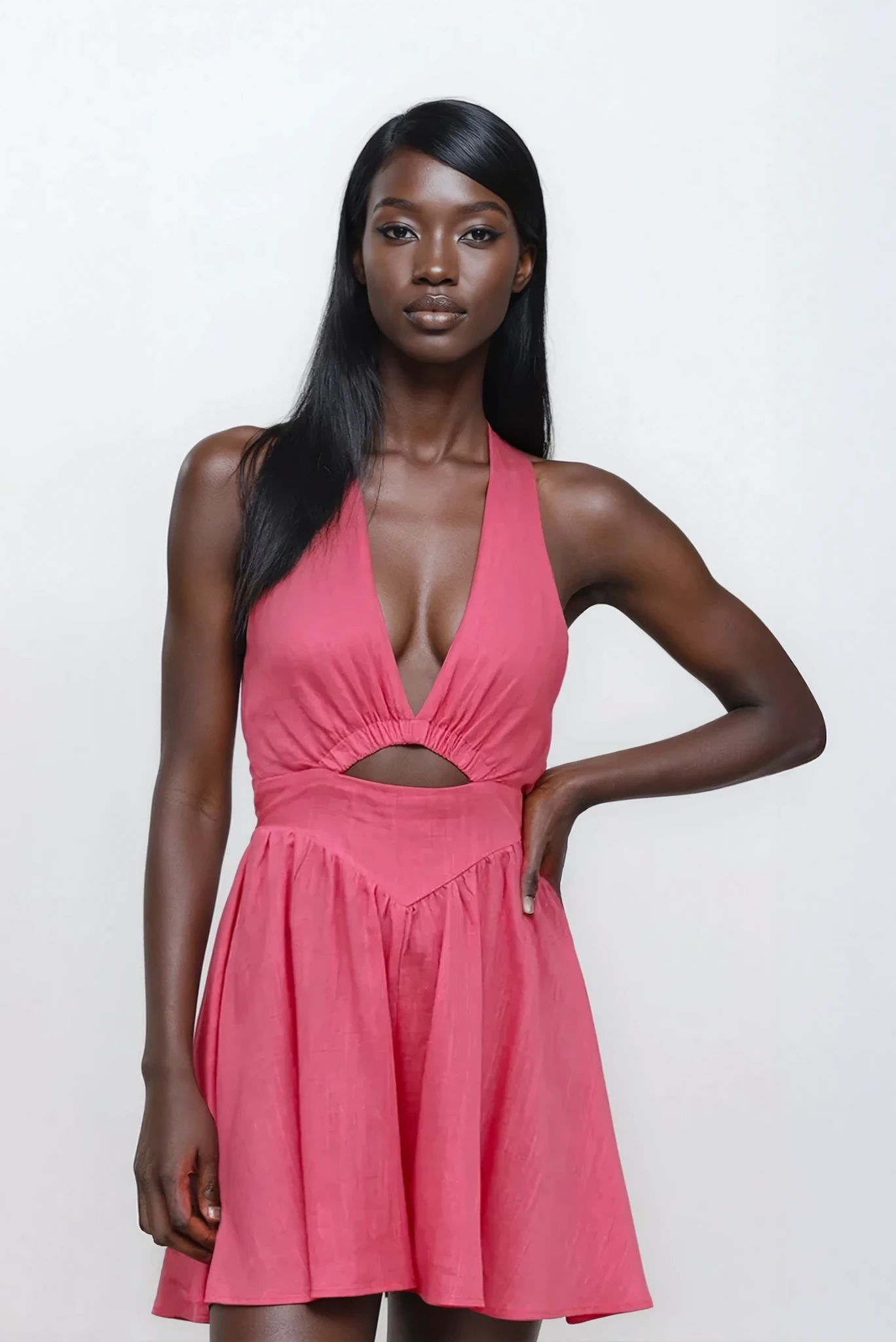 Lumina cutout halter neck mini dress by Trendsi, featuring a stylish design with cutouts and a halter neckline, shown on a model.