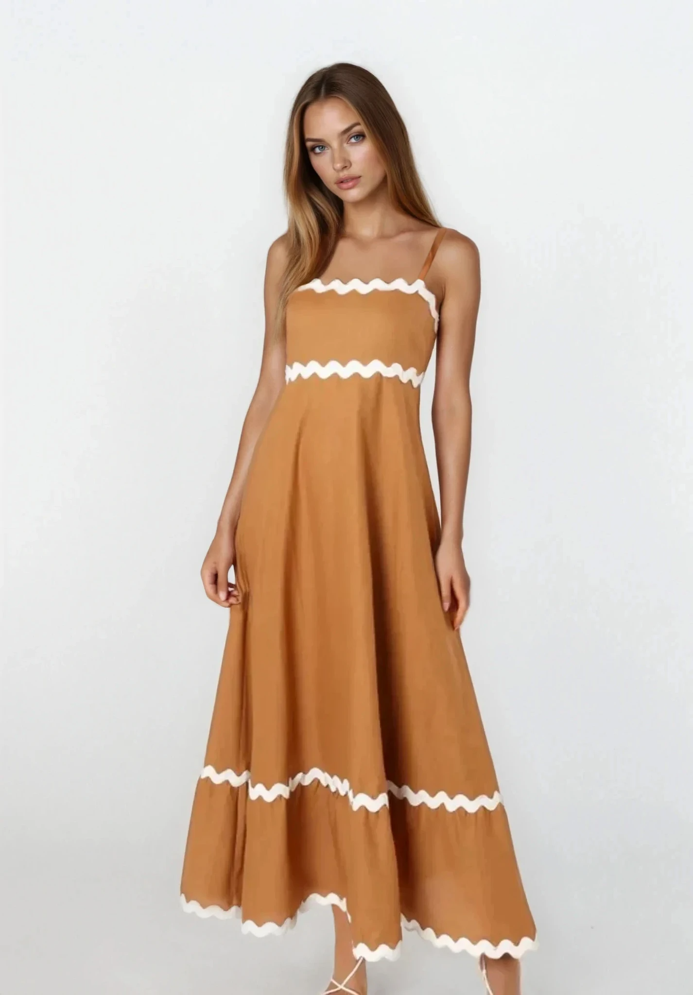 Light blue Tidal spaghetti strap maxi dress from Trendsi featuring a flowing silhouette and adjustable straps.
