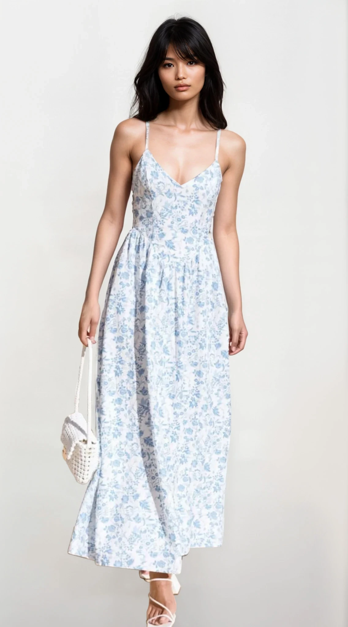 Light-colored Fleuron Bow Back V-Neck Cami Dress by Trendsi, featuring a bow back detail and v-neck design, perfect for casual or dressy wear.