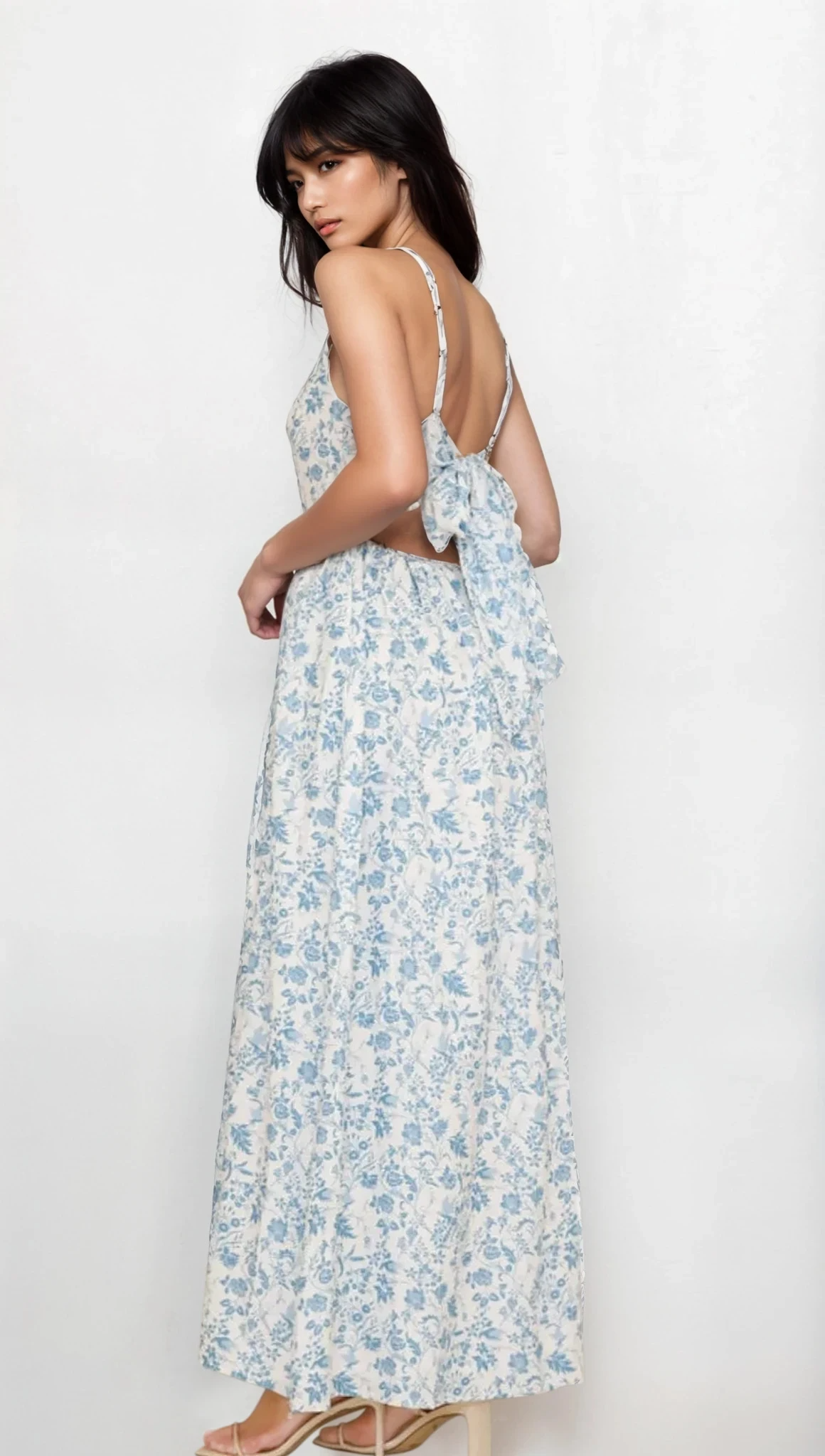 Light pink Fleuron Bow Back V-Neck Cami Dress by Trendsi, featuring a delicate bow detail and elegant V-neck design.