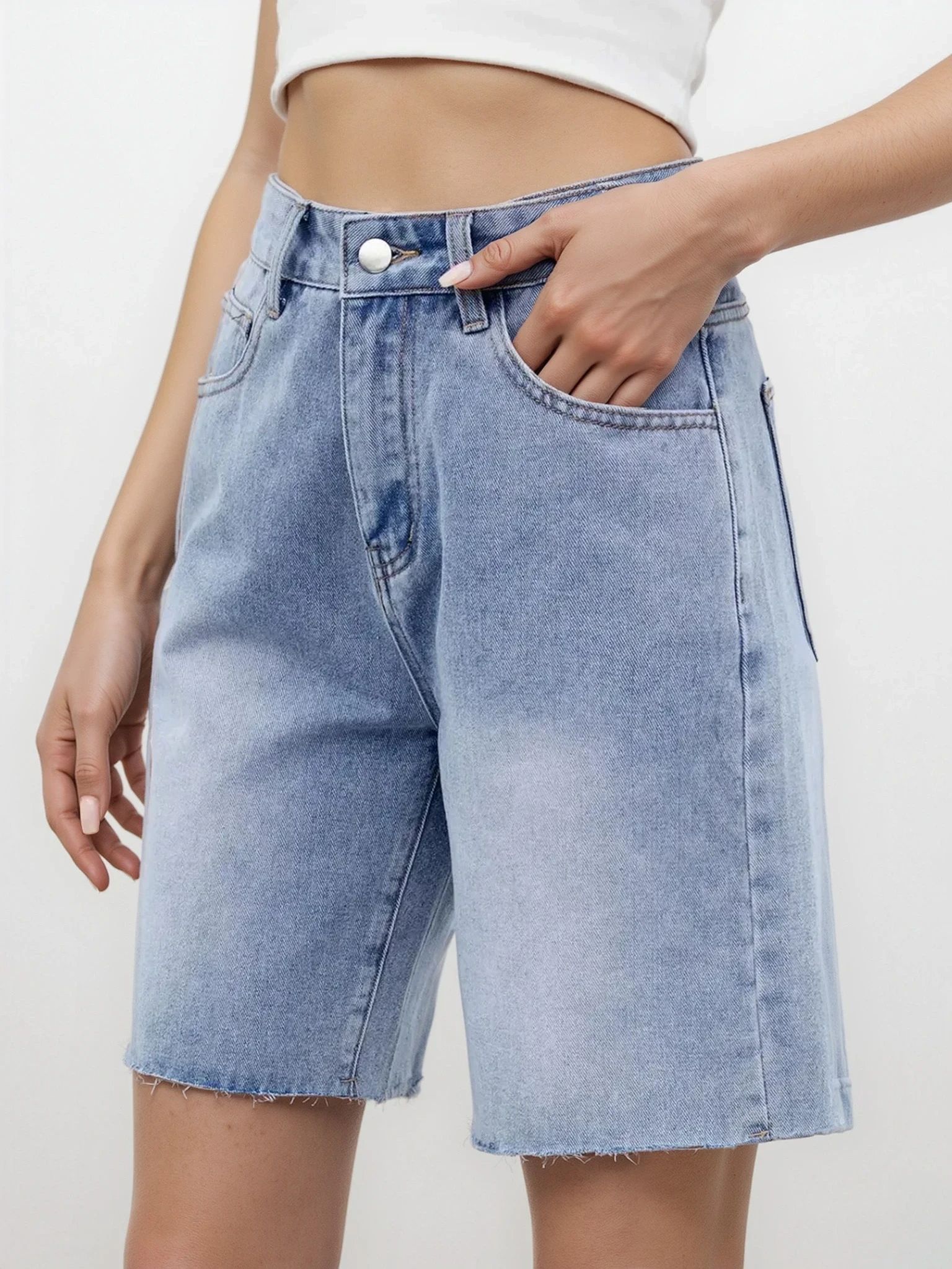 Light-wash Rogue Raw Hem Denim Shorts by Trendsi, casual clothing with distressed raw hem and classic denim style.