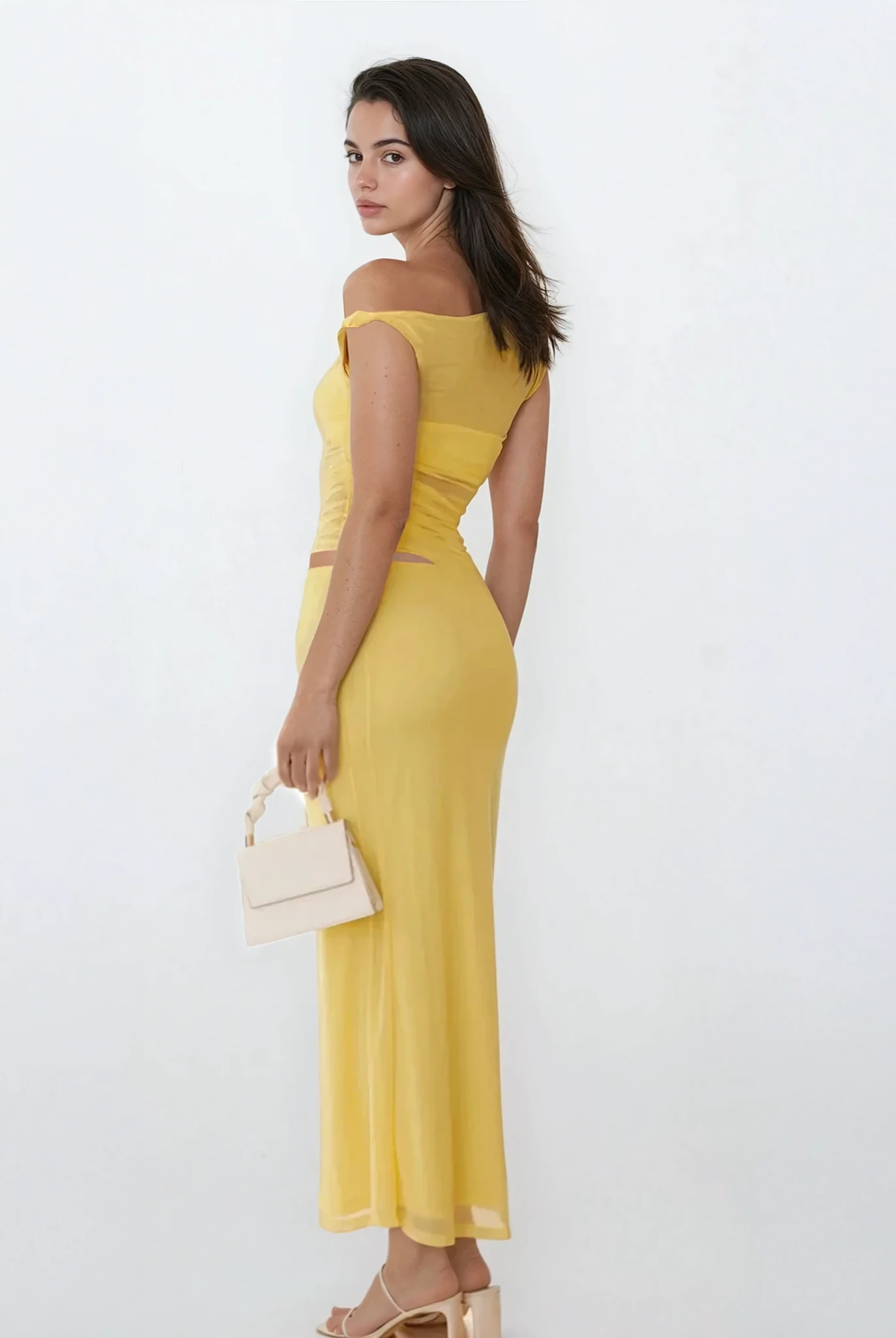 Light blue Echelon asymmetrical cutout sleeveless dress by Trendsi, featuring a stylish design with unique cutout details.