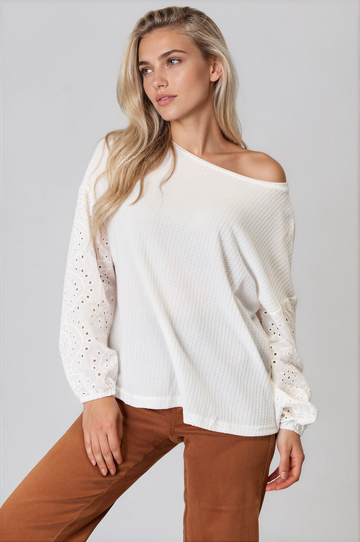 Ethereal Round Neck Eyelet Dropped Shoulder Blouse in white with textured fabric, eyelet sleeves, and an asymmetrical neckline
