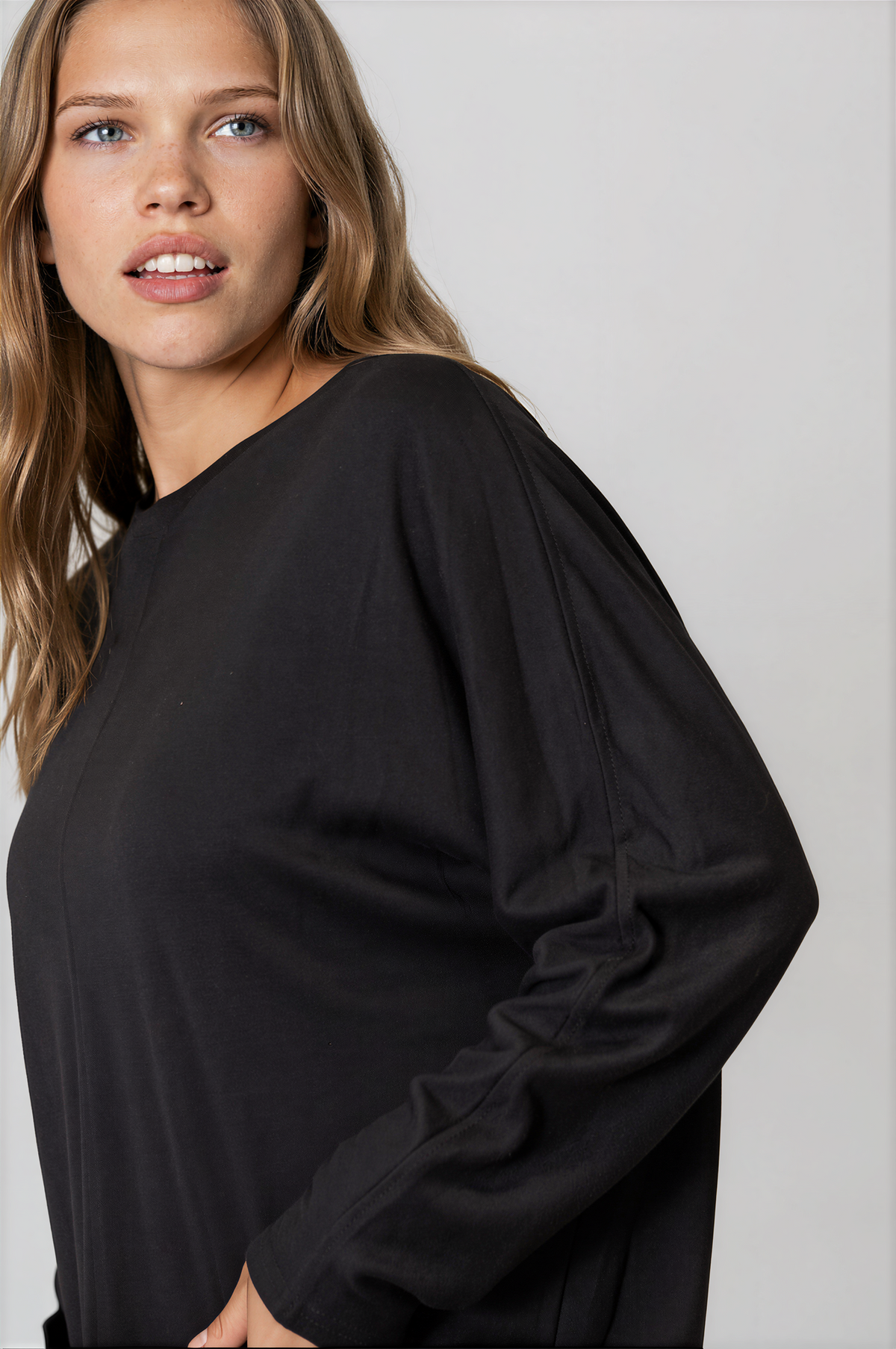 Everyday Round Neck Long Sleeve Top in solid black lightweight fabric, with a relaxed fit and gathered sleeve seam detail