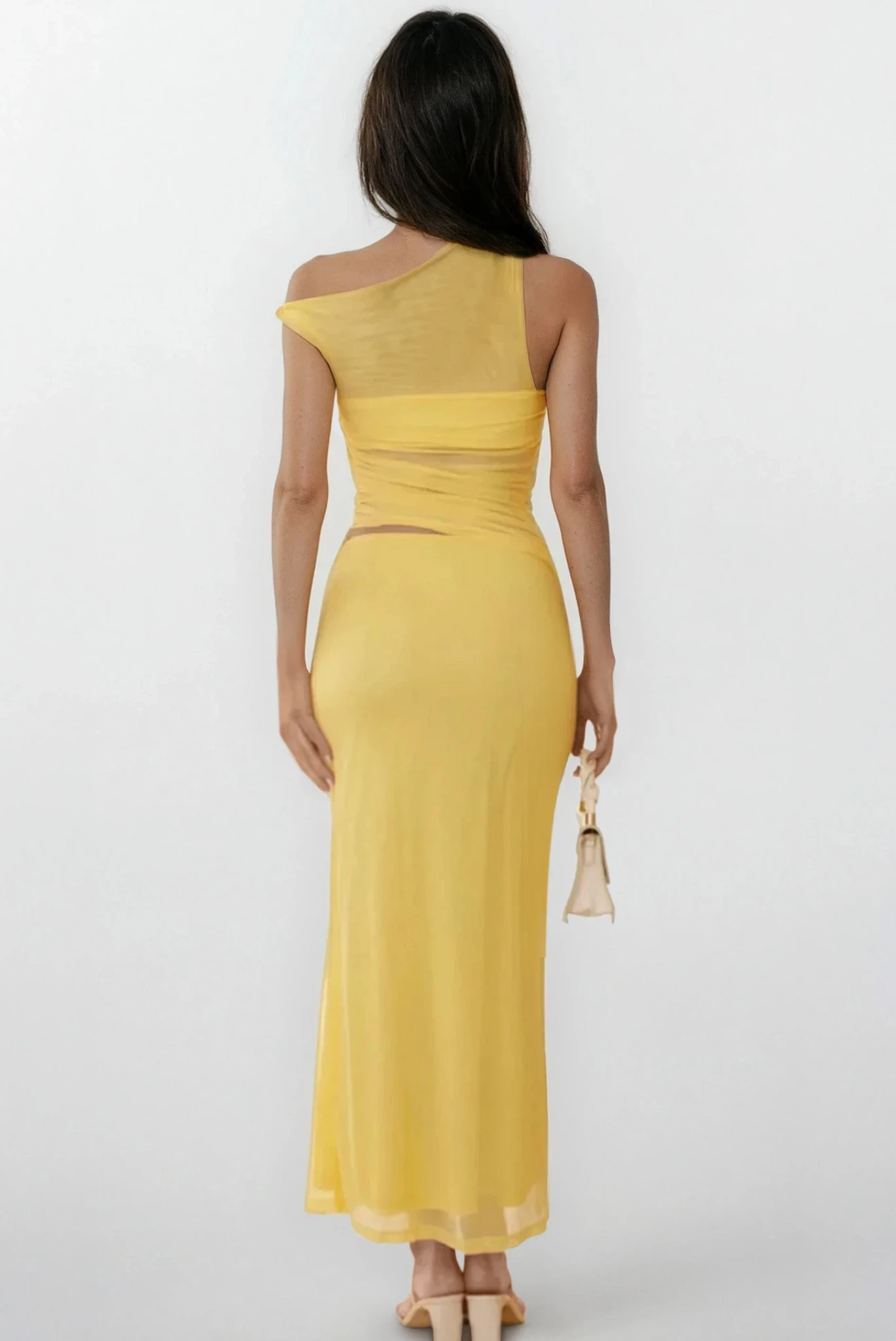 Light blue Echelon asymmetrical cutout sleeveless dress from Trendsi, showcasing its stylish design and unique cutout details.