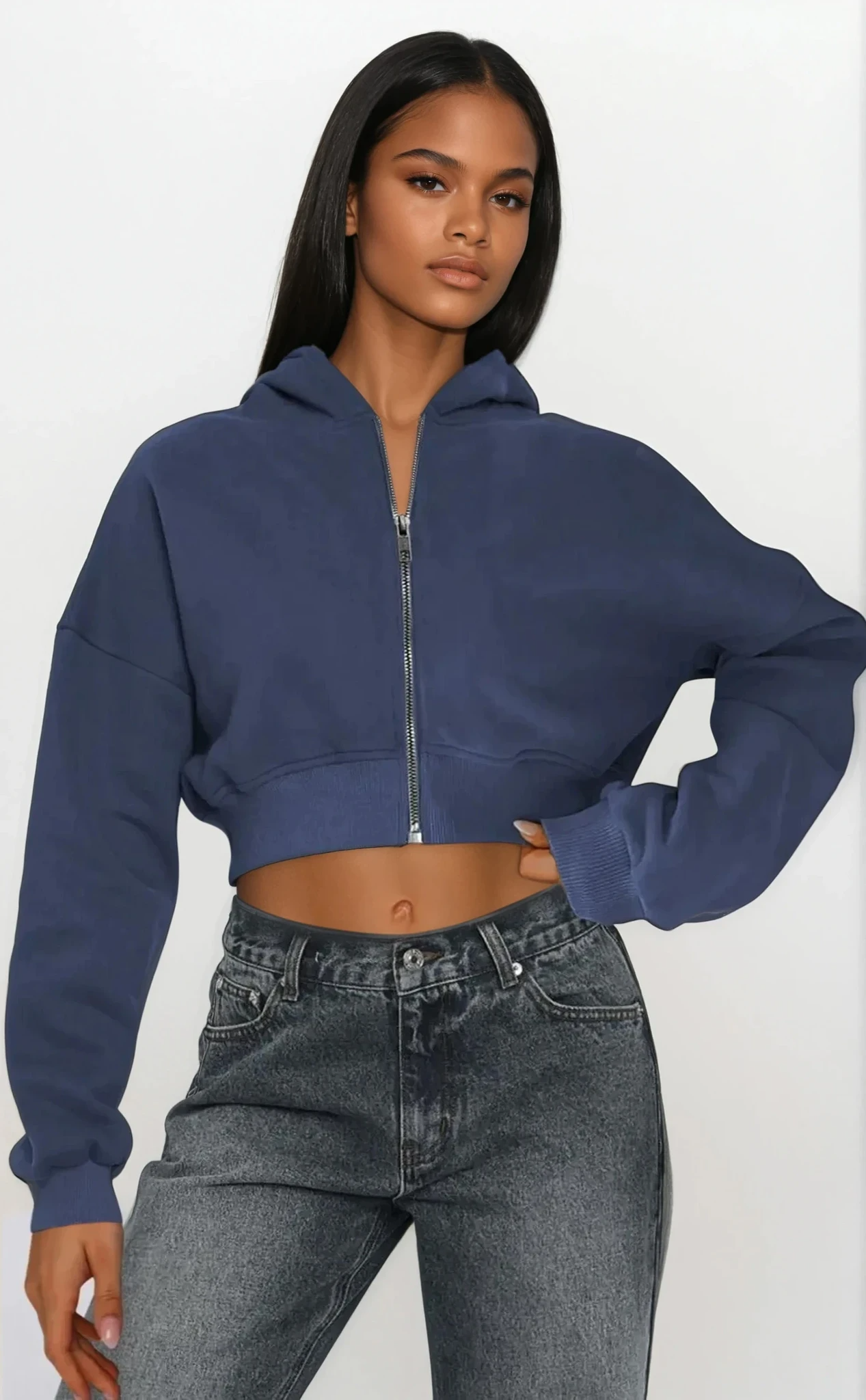 Light studio image of a Downtown Full Zip Cropped Hoodie by Trendsi, showcasing the stylish cropped hoodie with full zip closure.