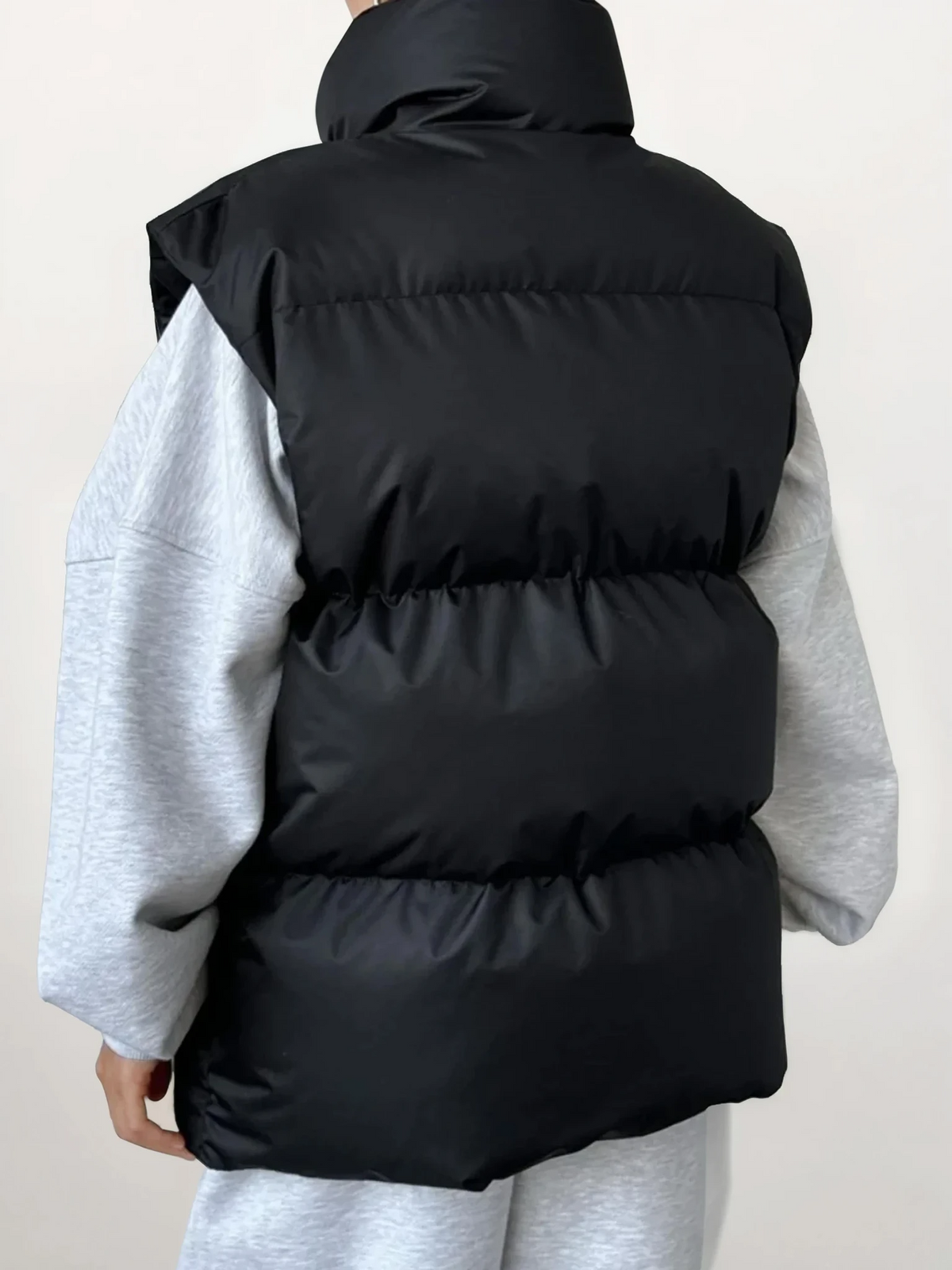 Icy turtleneck puffer vest in solid pattern with full zip