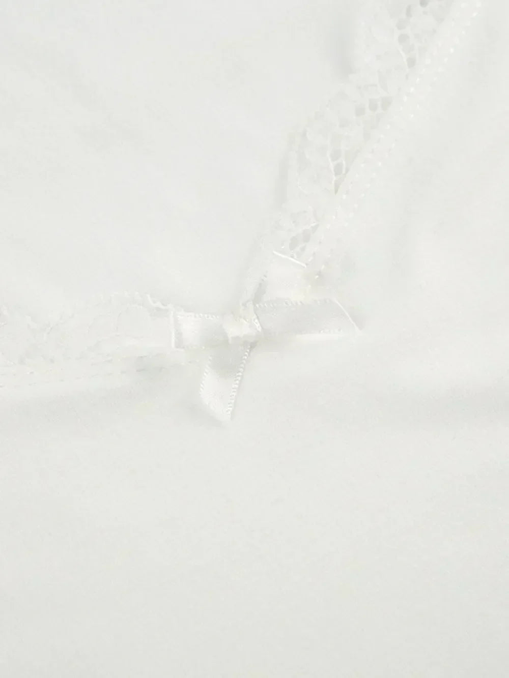 Lace sweetheart neck short sleeve blouse from Trendsi, featuring delicate lace fabric and a feminine, fitted design.