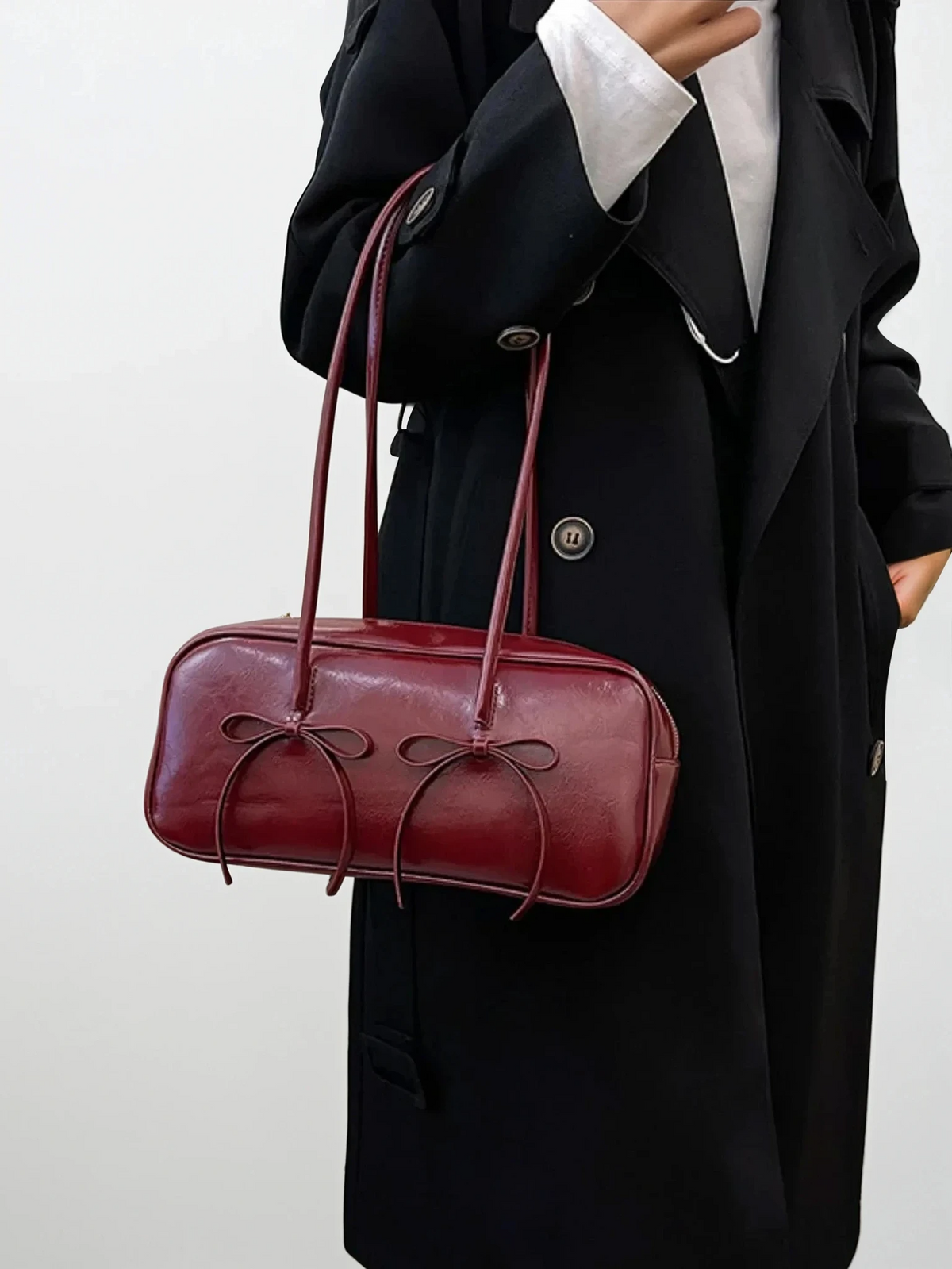 Leather bow trim shoulder bag with charming bows and solid pattern