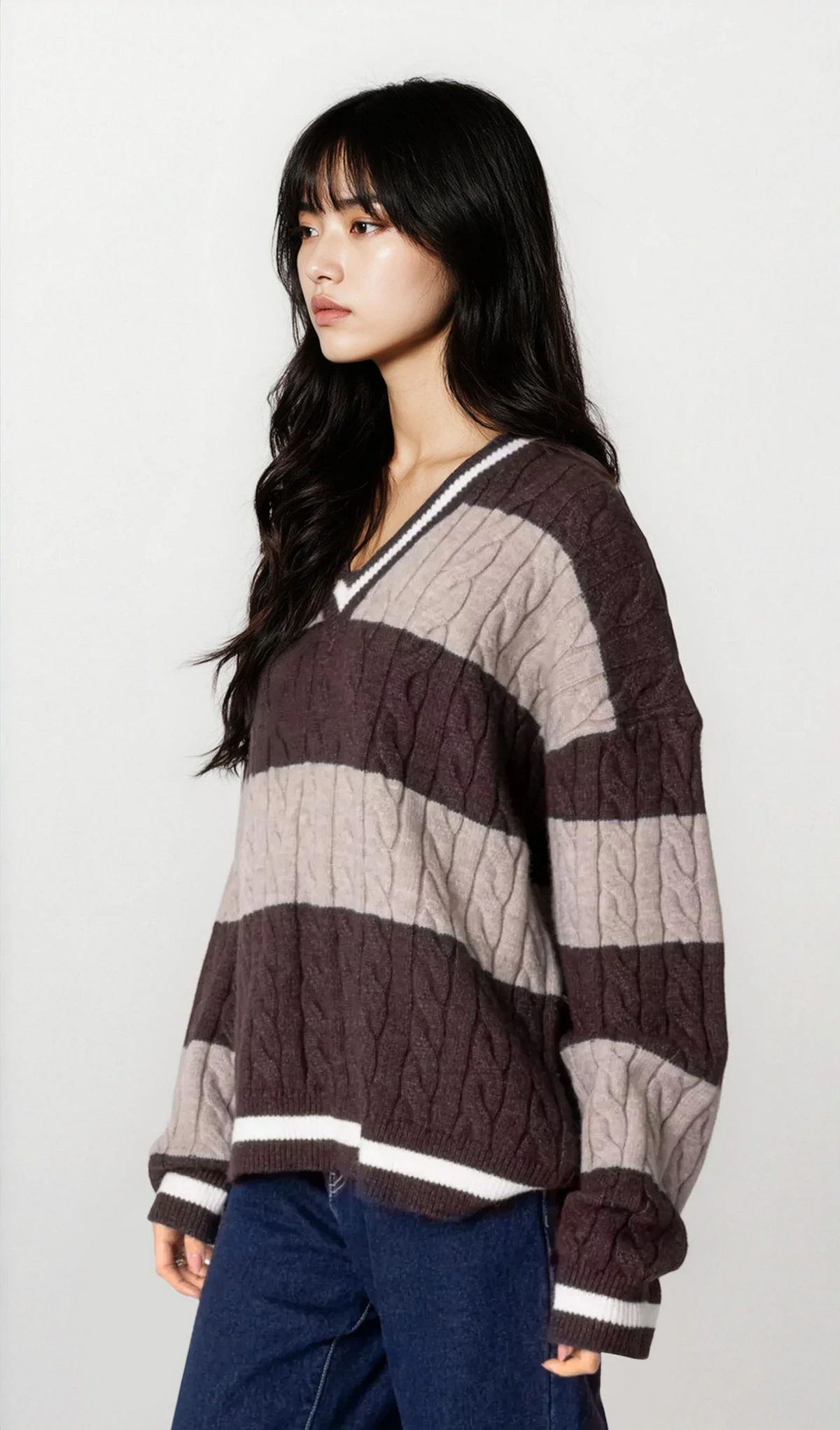 Oversized striped cable knit v-neck sweater in cozy cable knit with bold stripes