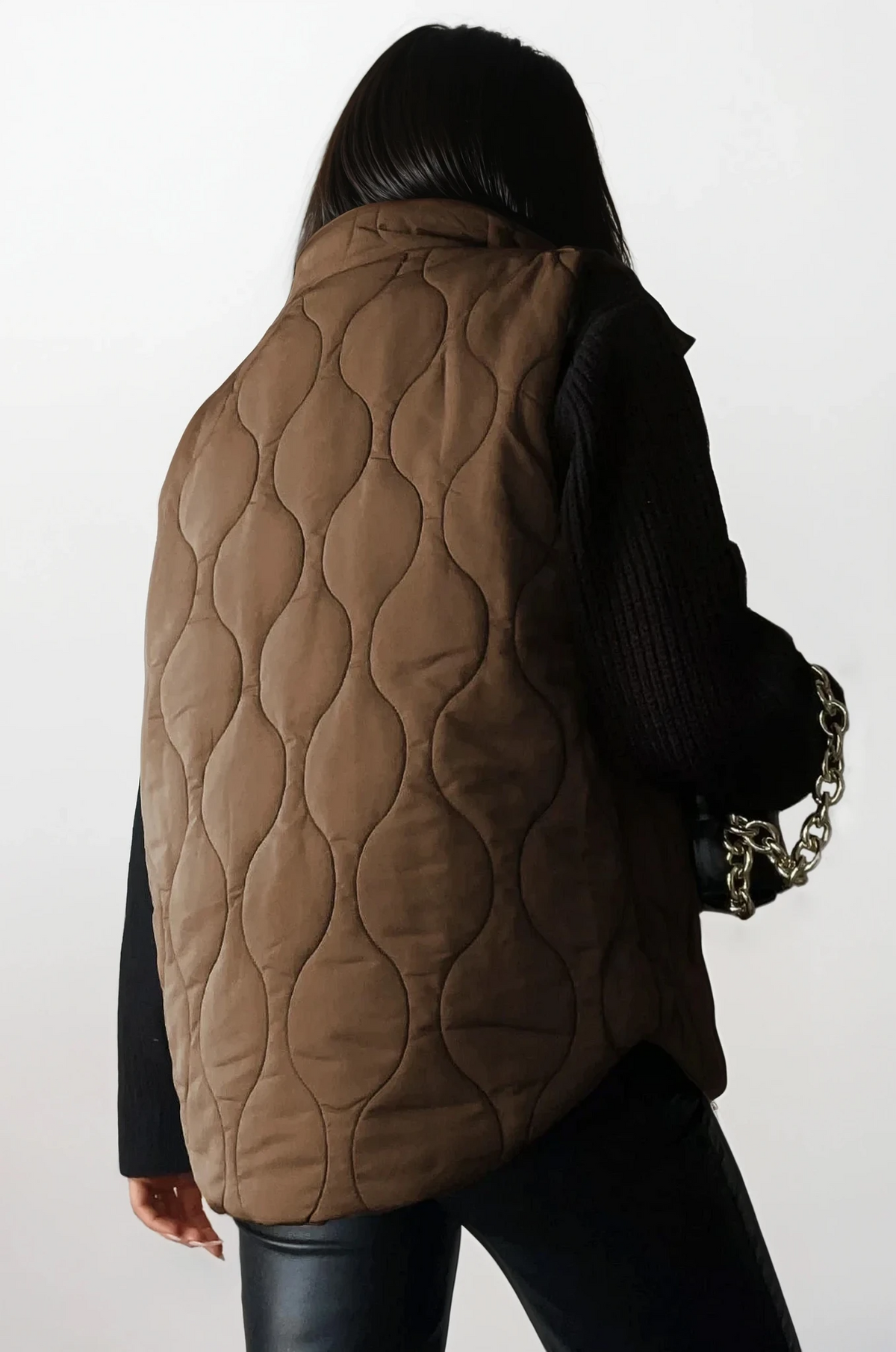 Quilted collared neck vest with sleeveless design and pockets