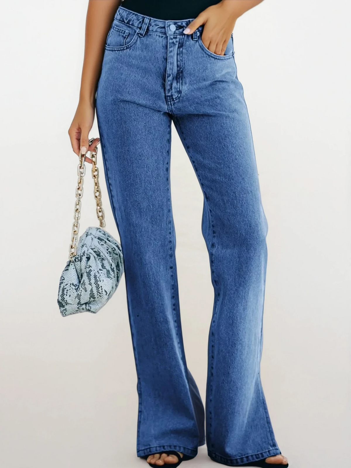 Woman wearing side slit bootcut jeans with buttoned closure