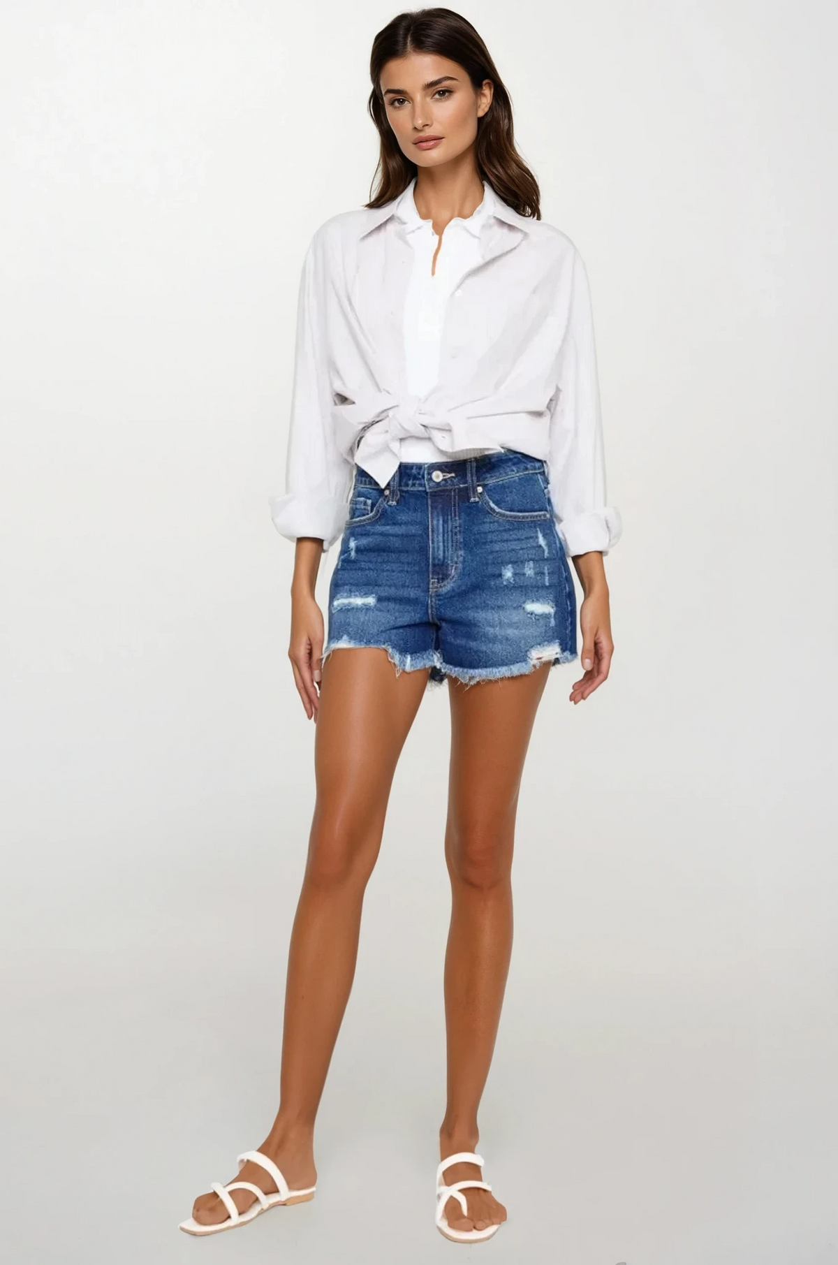 Signature high-waist distressed denim shorts with frayed hem
