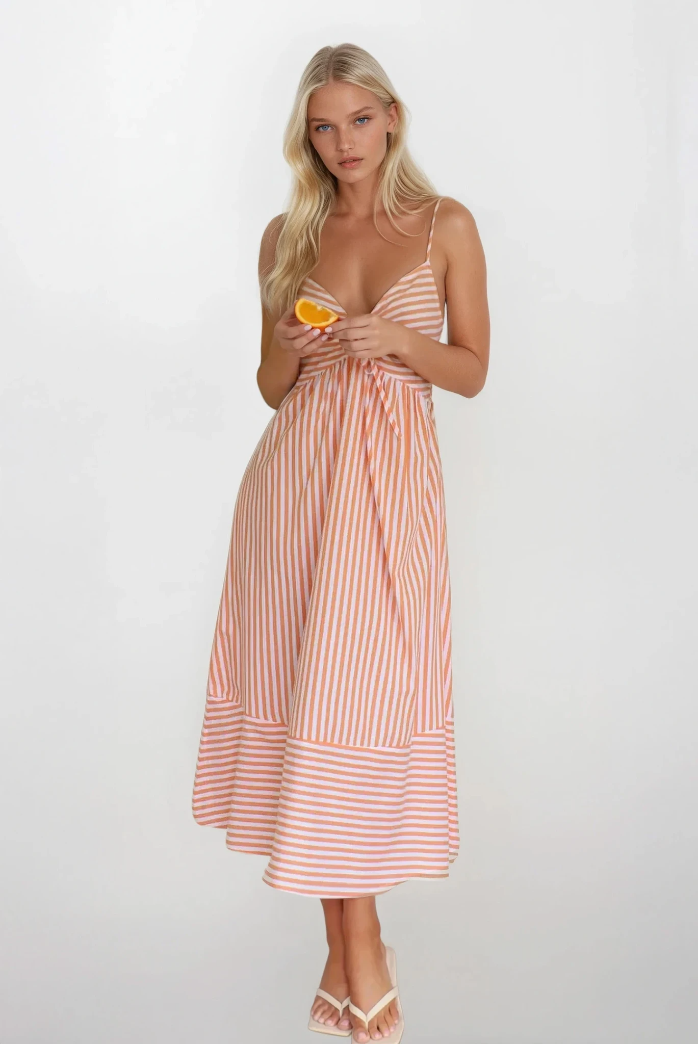 Sunset Stripe Cami Midi Dress by Trendsi featuring a light, flowing fabric with a vibrant sunset stripe pattern, sleeveless design.