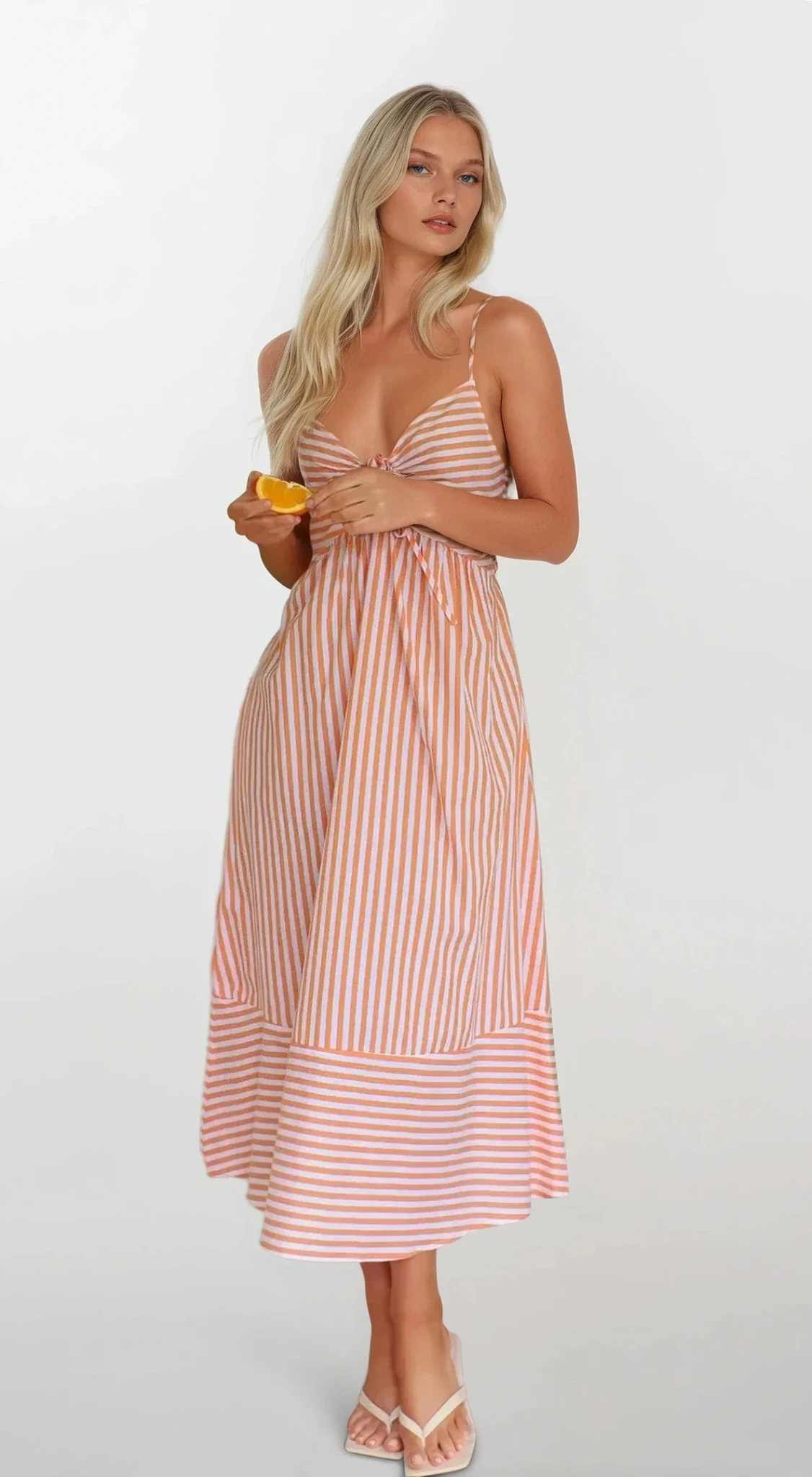 Sunset Stripe Cami Midi Dress by Trendsi featuring a flowy silhouette, vibrant sunset stripe pattern, and lightweight fabric.