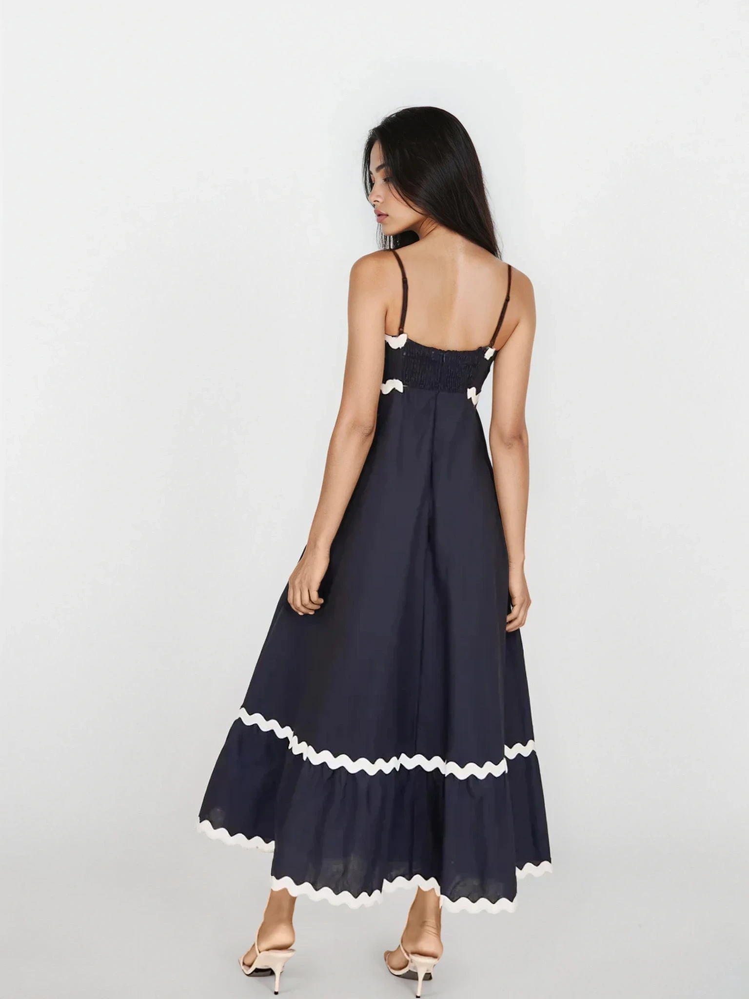 Light blue Tidal spaghetti strap maxi dress by Trendsi, flowing fabric, fitted bodice, and ankle-length silhouette.