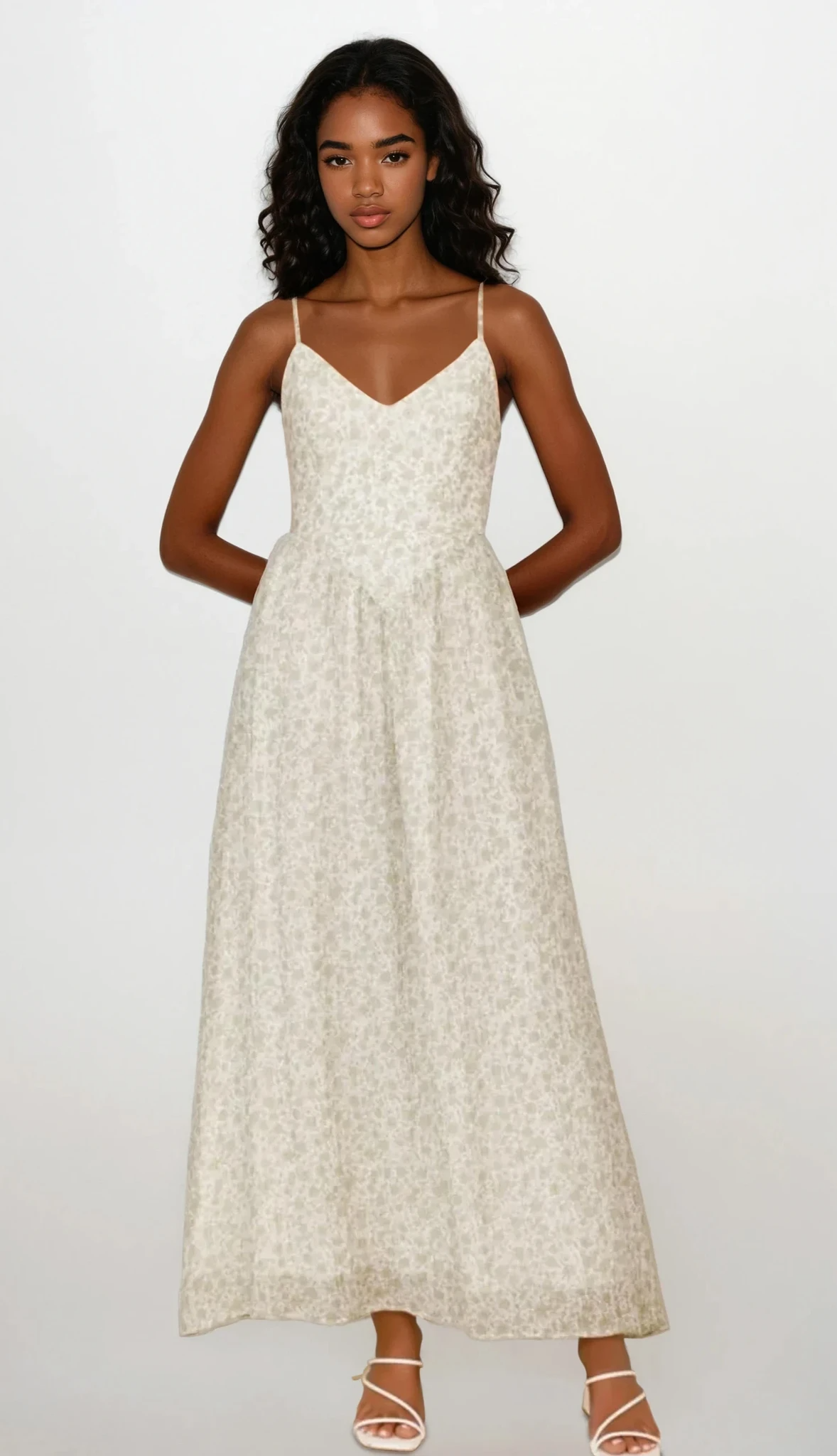 Fleuron Bow Back V-Neck Cami Dress by Trendsi featuring a flowy fabric, bow back detail, and V-neck design, perfect for stylish summer wear.