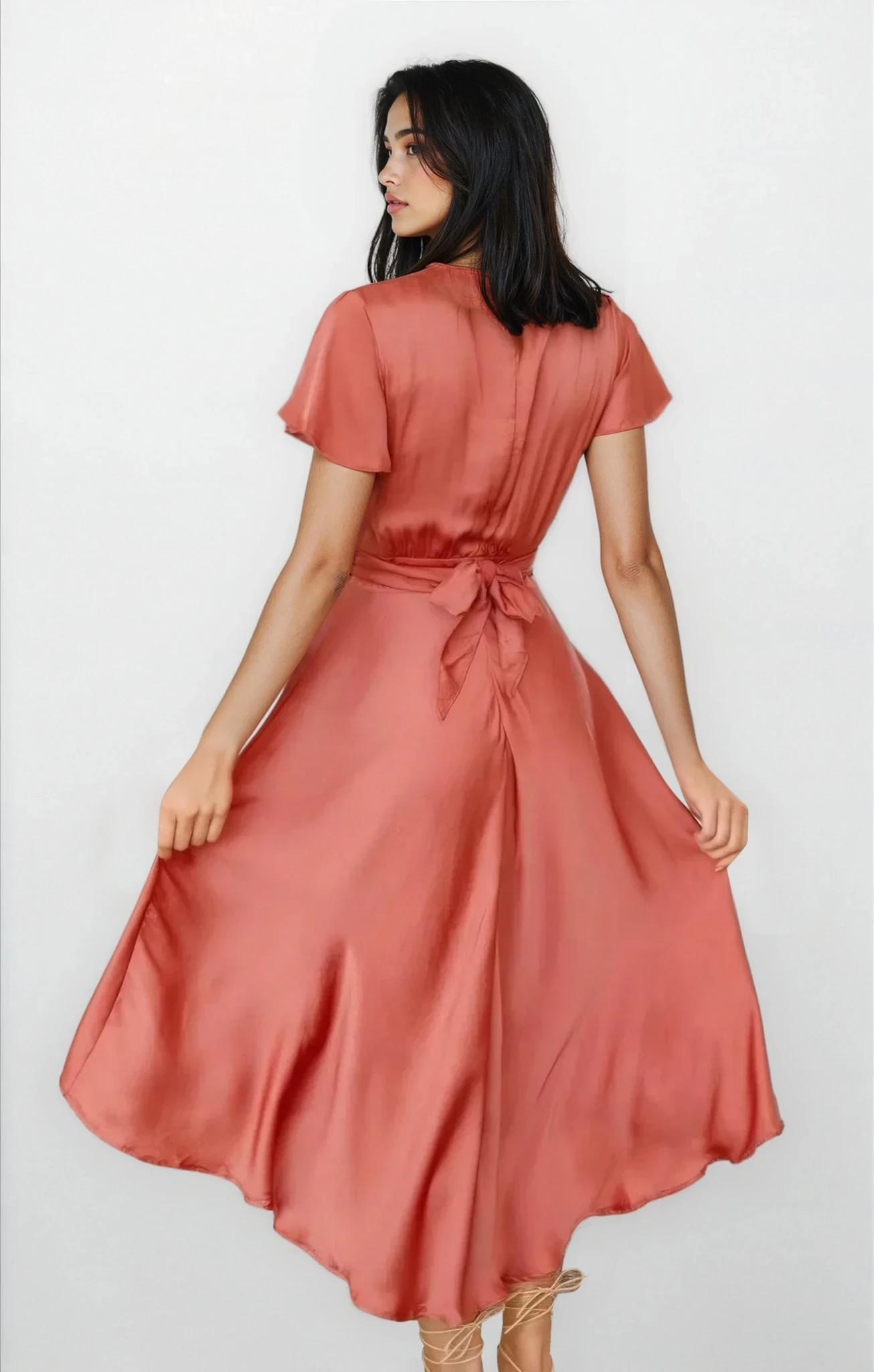 Light blue Evolve v-neck high-low flutter sleeve dress by Trendsi, flowing fabric, stylish design, and elegant silhouette.